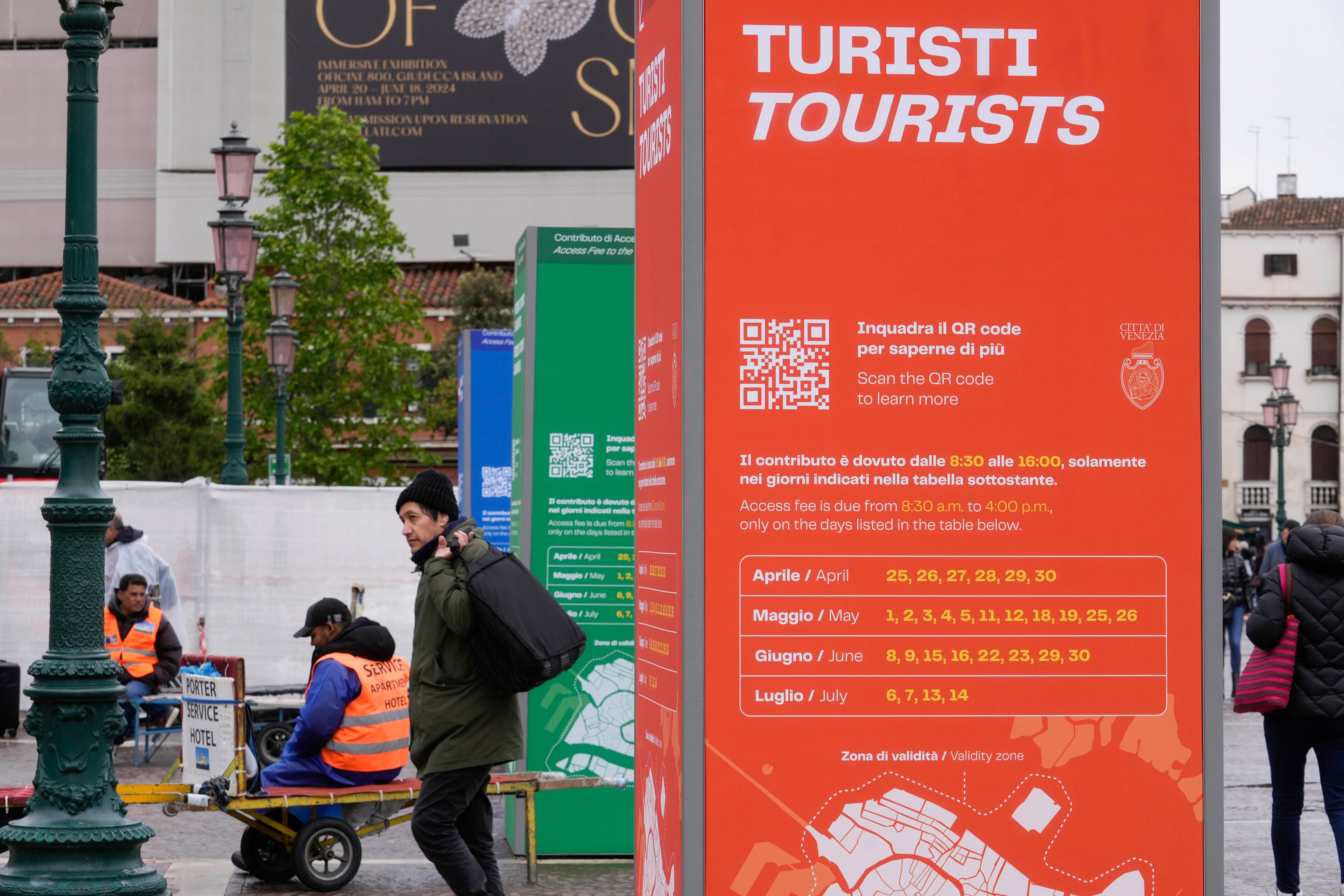 Tourist information boards are seen outside the main train station in Venice