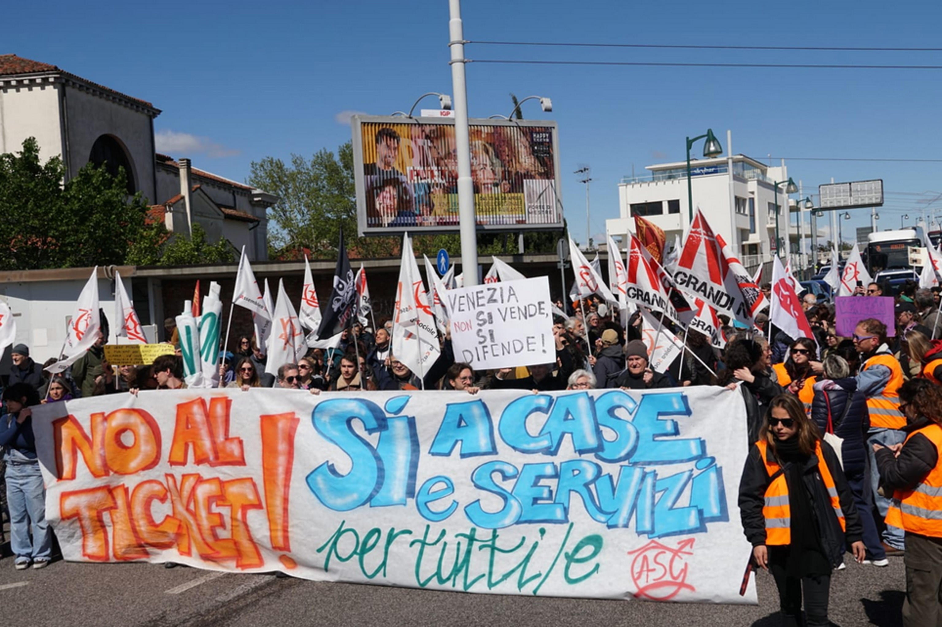 Members of social centers take part in a demonstration in Piazzale Roma against the introduction of an entrance fee to the city for day-trippers, in Venice