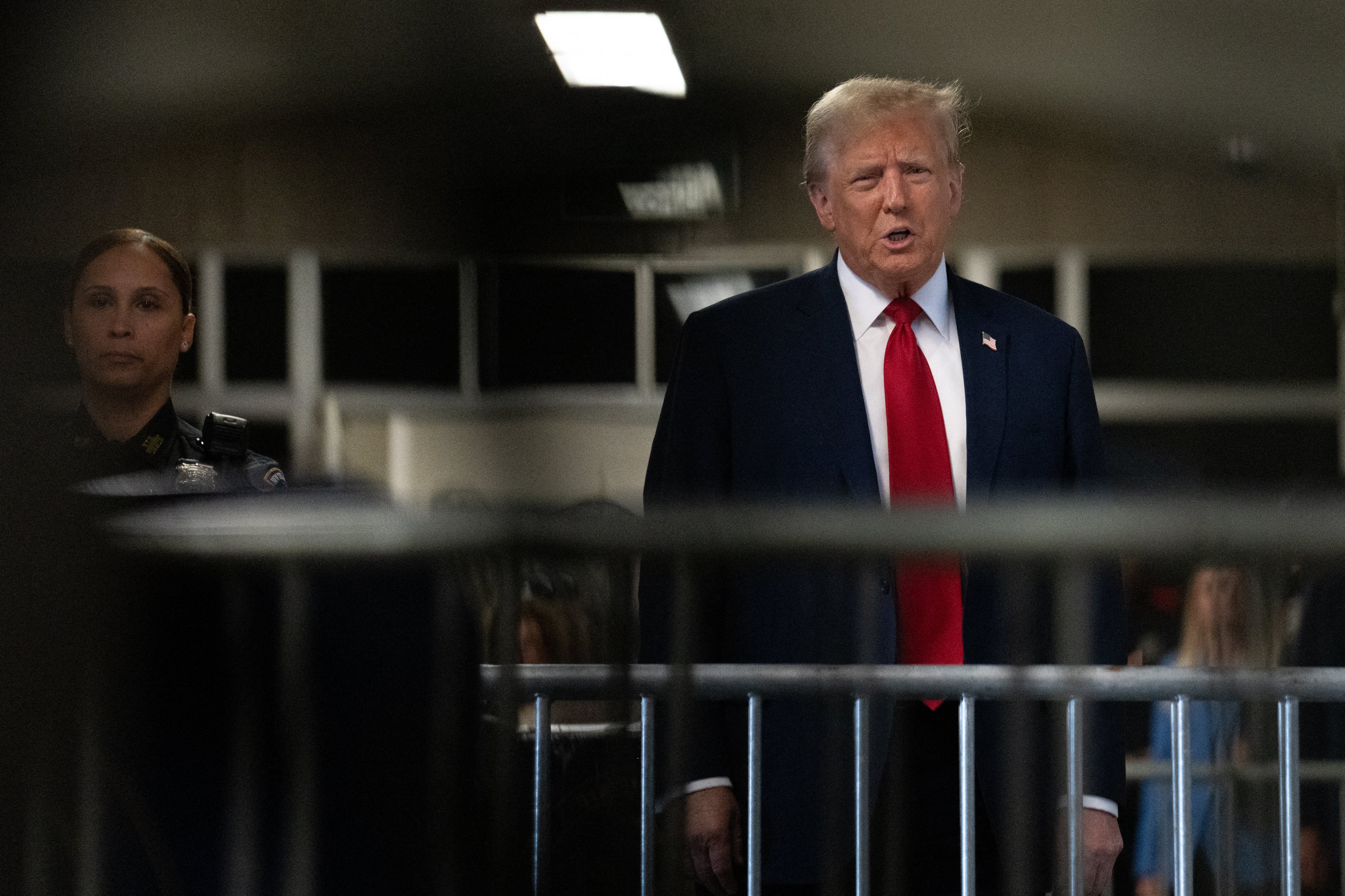 Donald Trump speaks to reporters before entering a criminal courtroom in Manhattan on 25 April