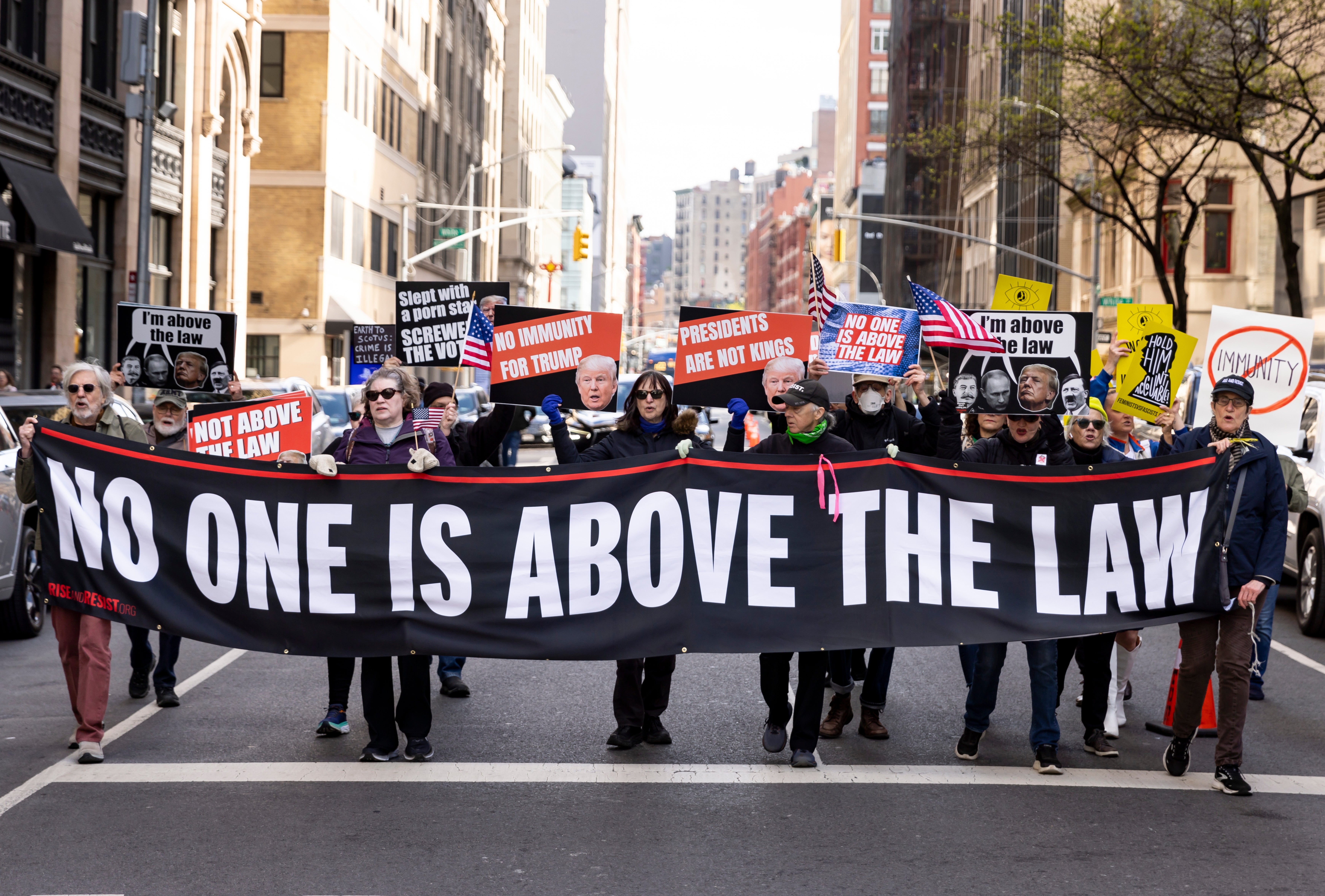 Anti-Trump protesters outside his first criminal trial on 25 April 2024