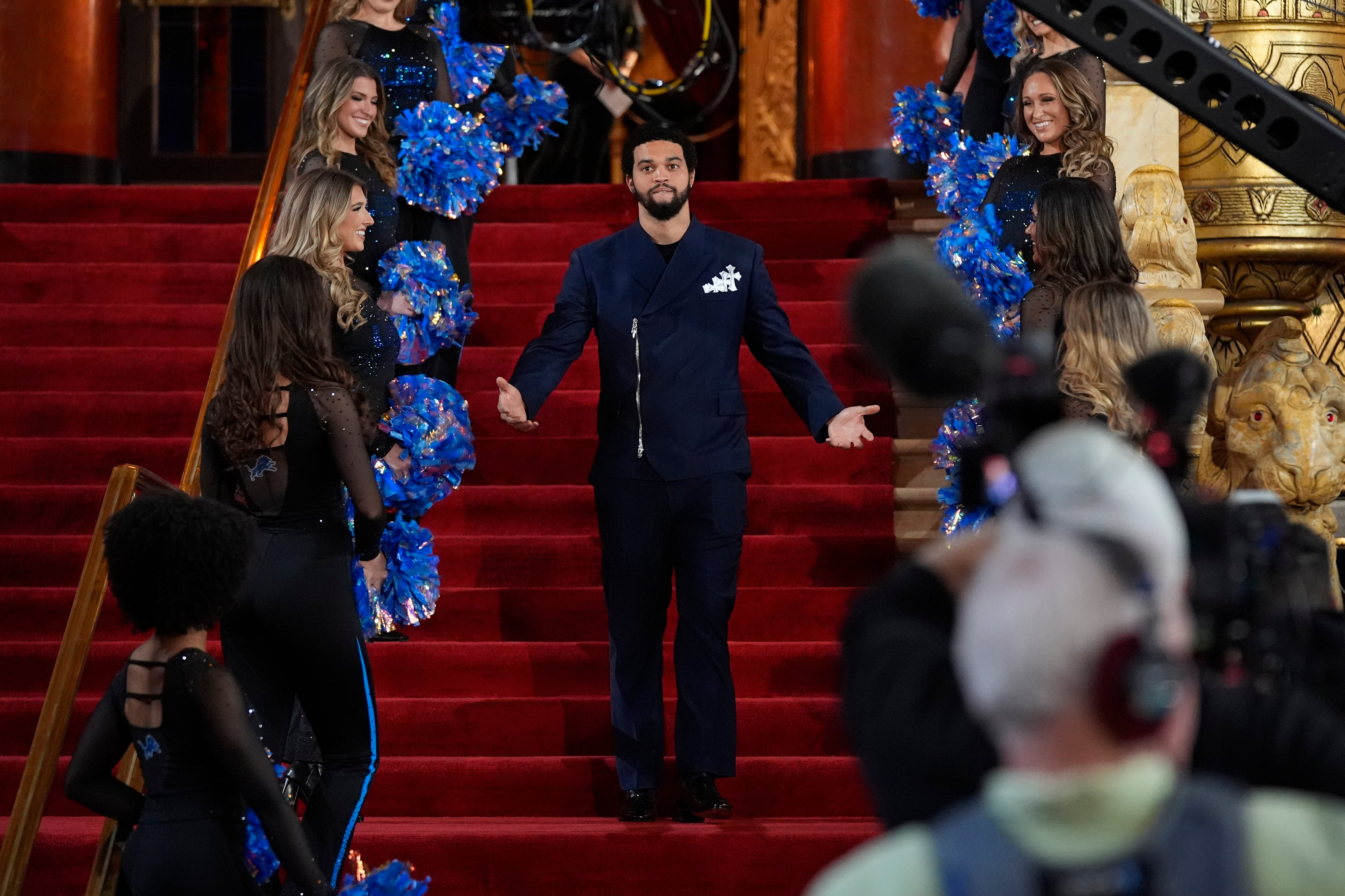 Caleb Williams poses on the red carpet ahead of the first round of the NFL football draft in Detroit