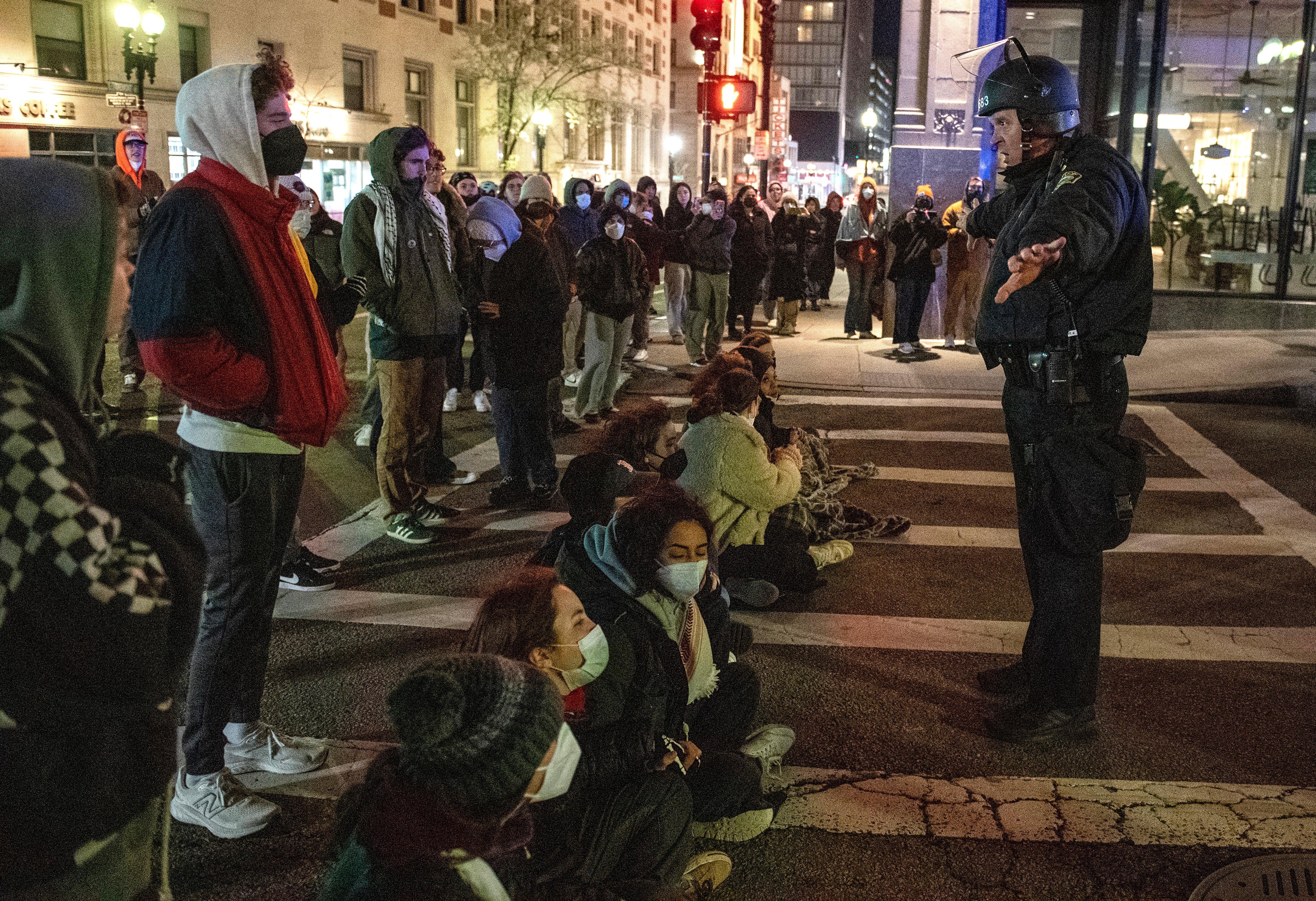 Police and pro-Palestinian supporters face off after the Emerson College Palestinian protest camp was cleared by police in Boston