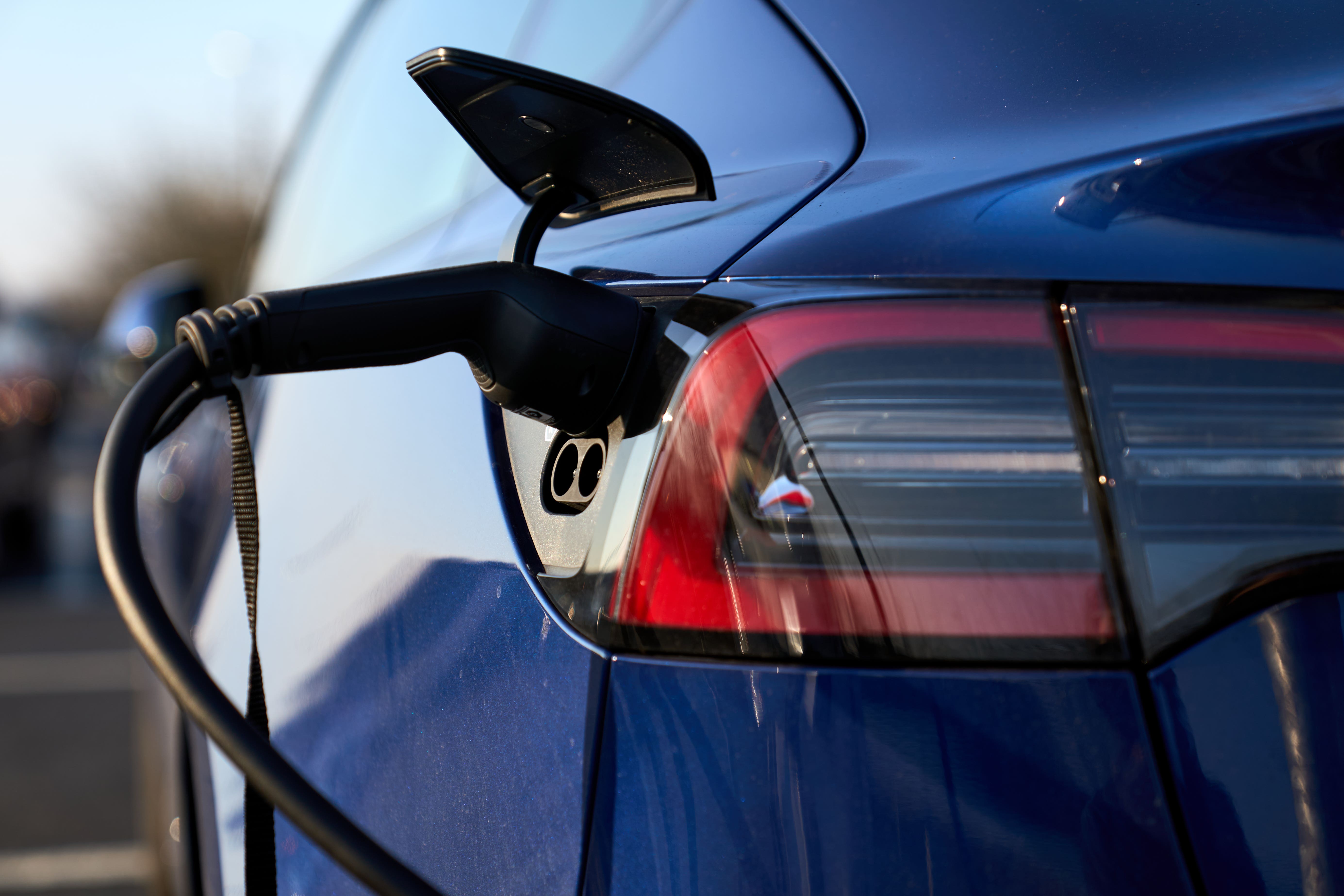 An electric car being charged (John Walton/PA)