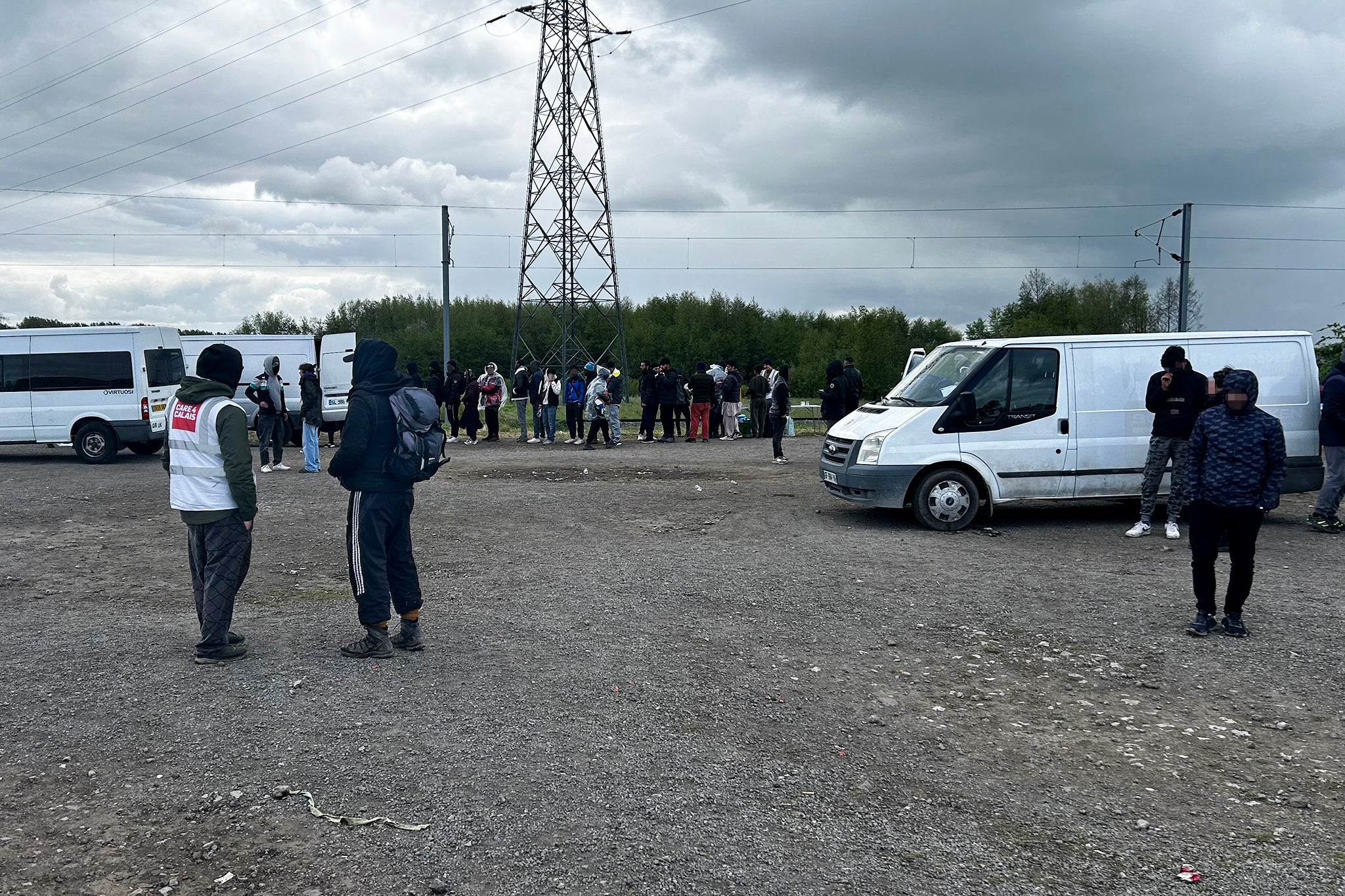 Charities give out blankets, groundsheets and tents to refugees who live in the woods round Dunkirk