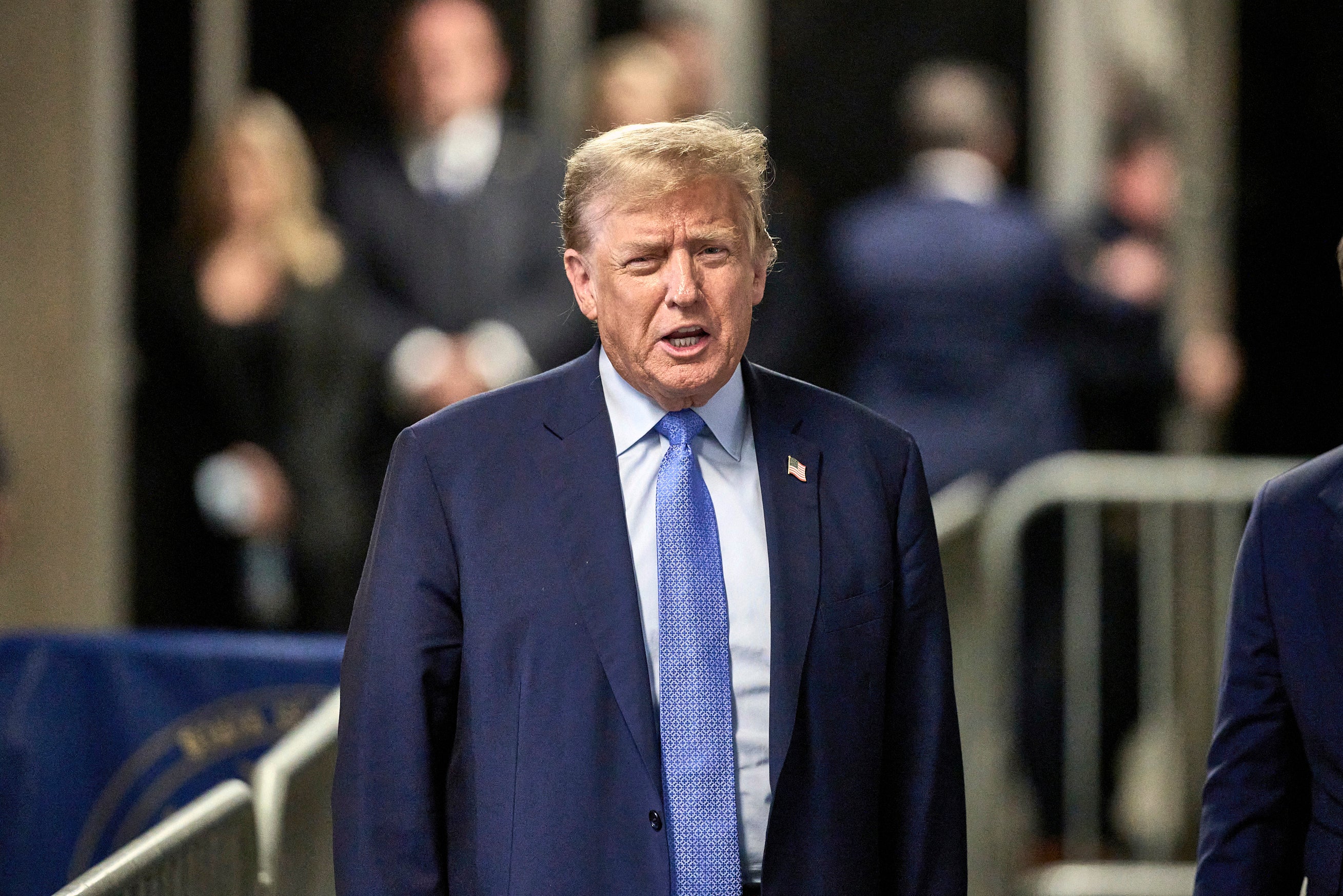 Former president Donald Trump speaks with the media at the end of the day’s proceedings at his trial at Manhattan Criminal Court on Friday 26 April 2024