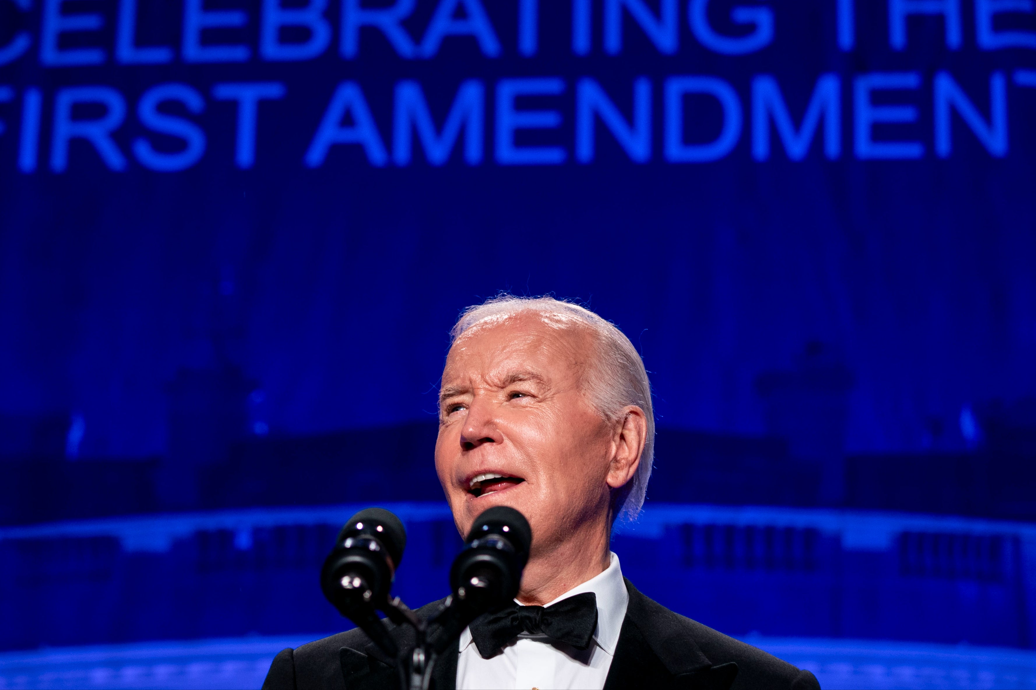 President Joe Biden speaks on stage at the White House Correspondents Dinner