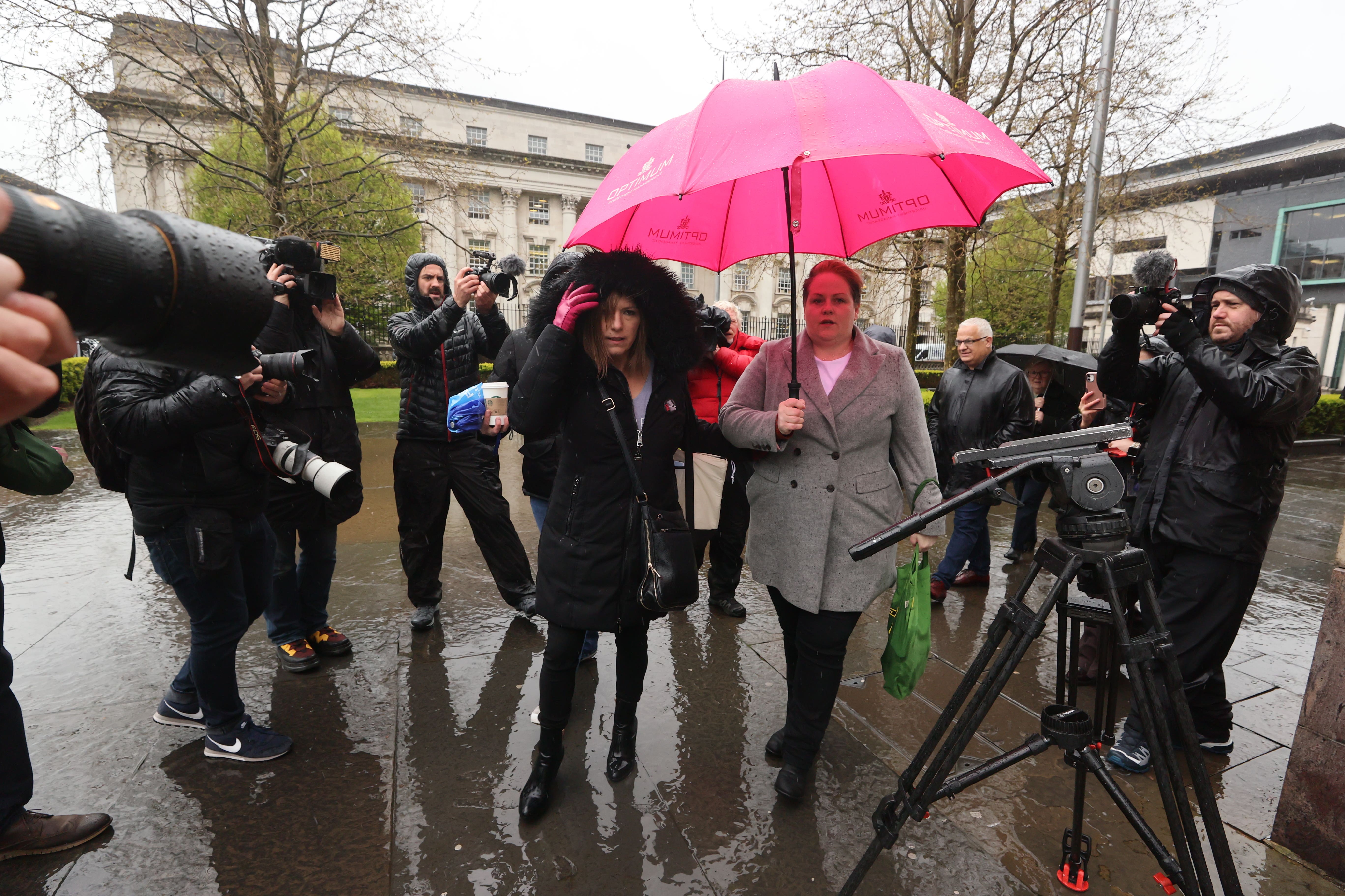 Lyra McKee’s sister Nichola Corner (left) and partner Sara Canning outside Laganside Court in Belfast (PA)