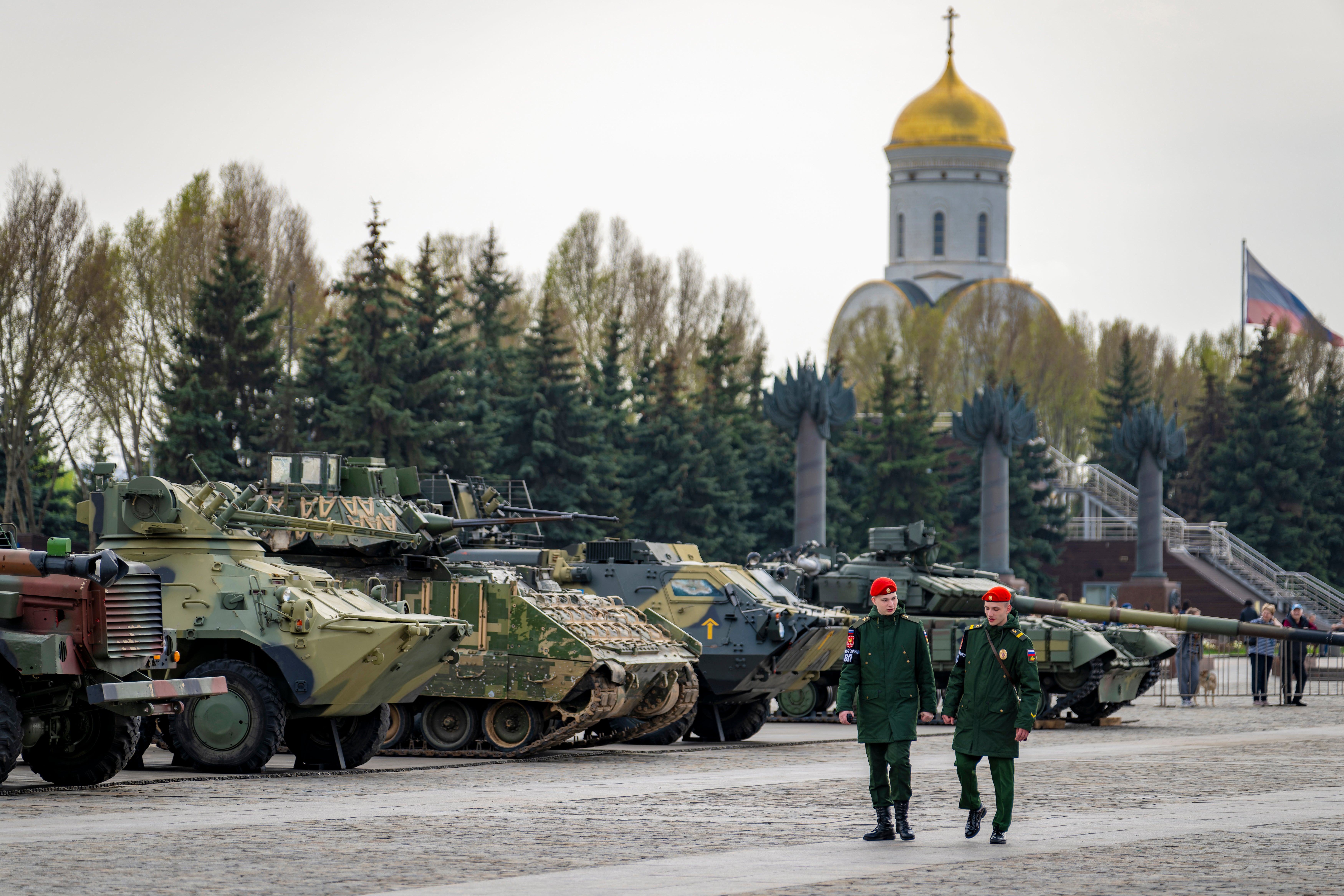 People visit an exhibition of tanks, APCs and guns of Ukrainian armed forces captured during the fighting displayed near the World War II museum on Poklonnaya Hill in Moscow.