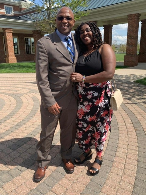 Ohio engineer Eric Nshimiye, who has been charged by federal authorities in connection with alleged genocidal activities in his native Rwanda dating back decades, poses with his wife