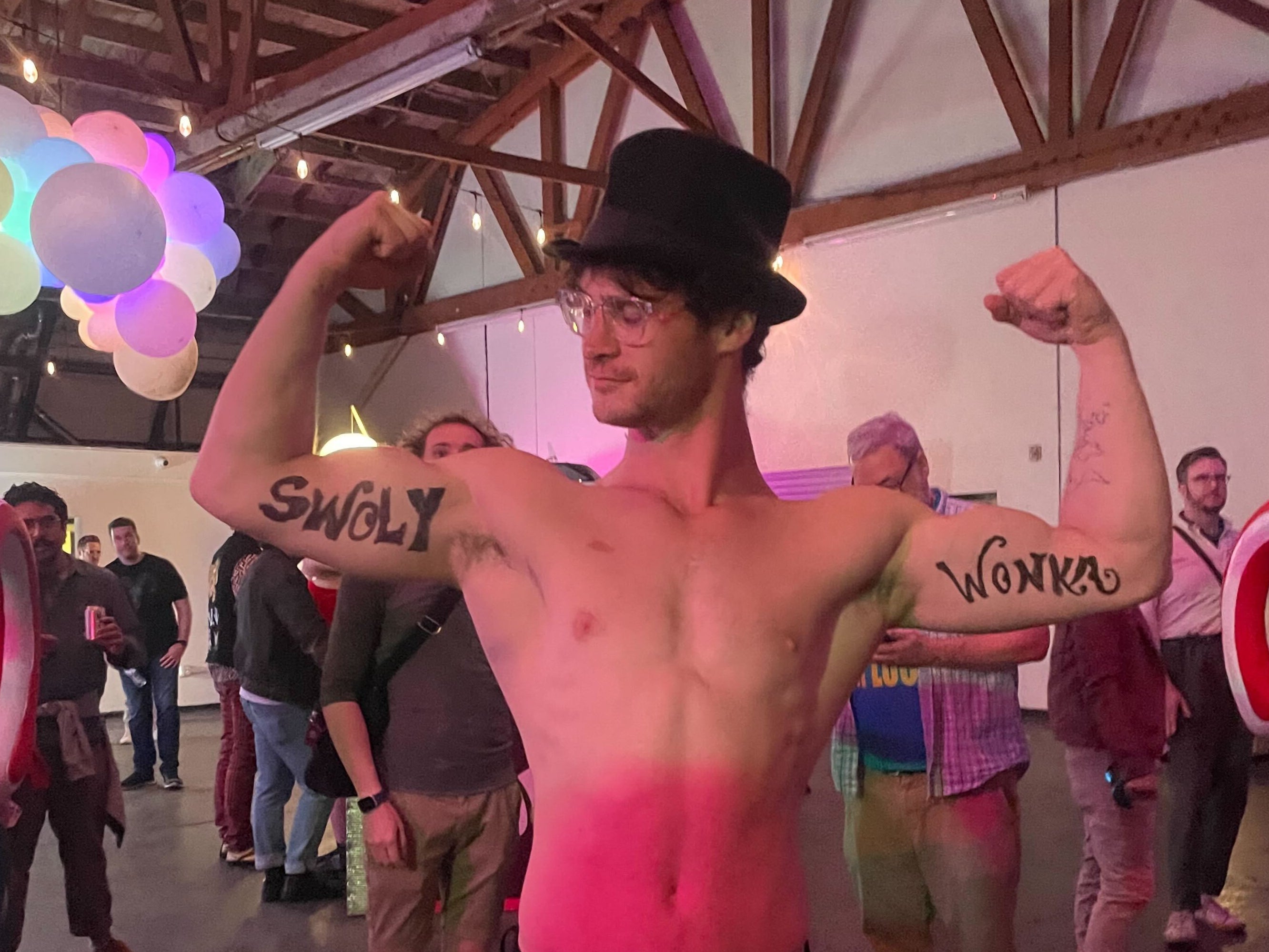 Willy Wonka’s self-described bodyguard “Swoly Wonka” poses for the camera at the Willy Wonka Experience in Downtown Los Angeles, California on 28 April.