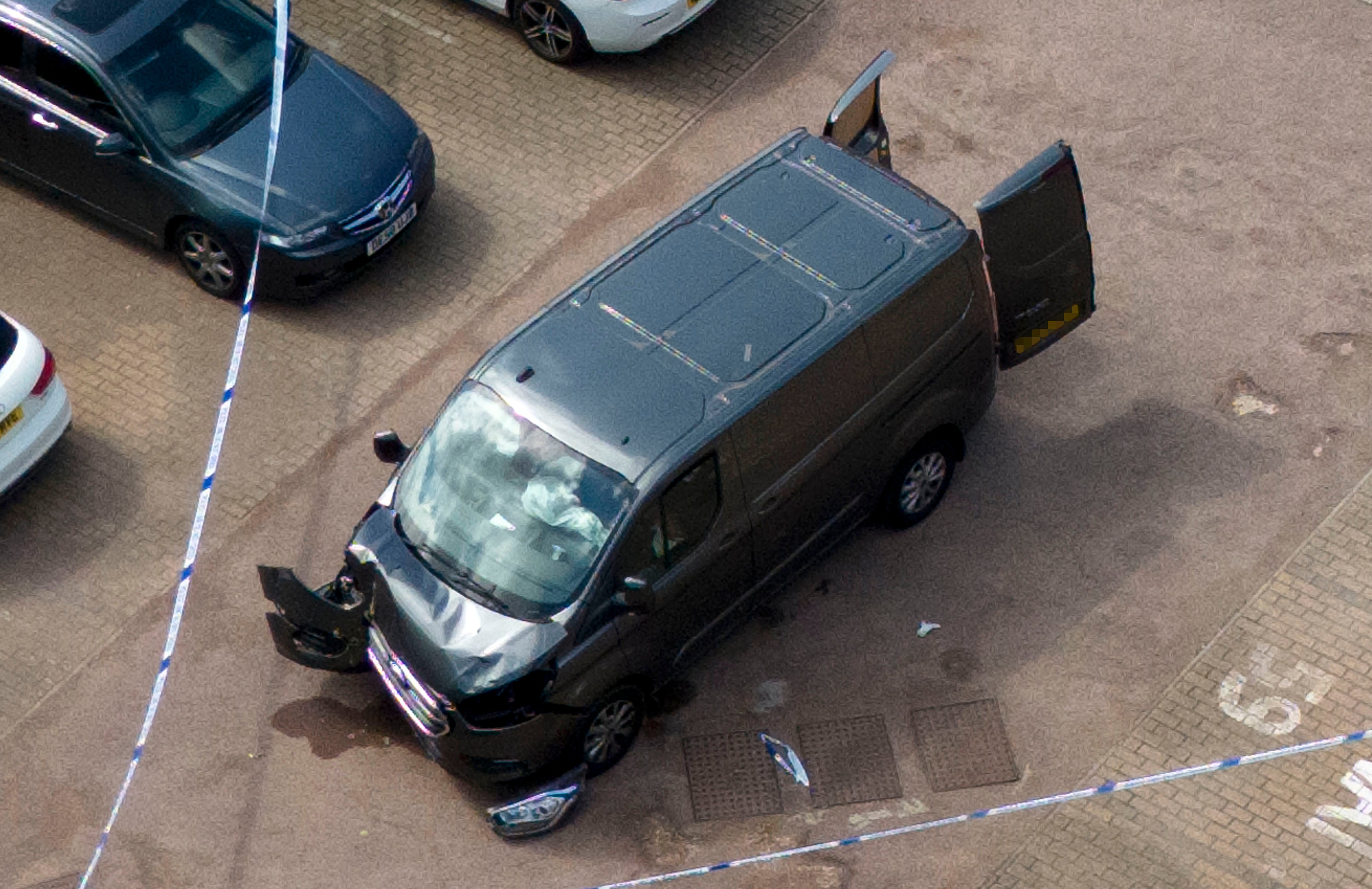 Police tape around a van on Laing Close in Hainault, following the incident