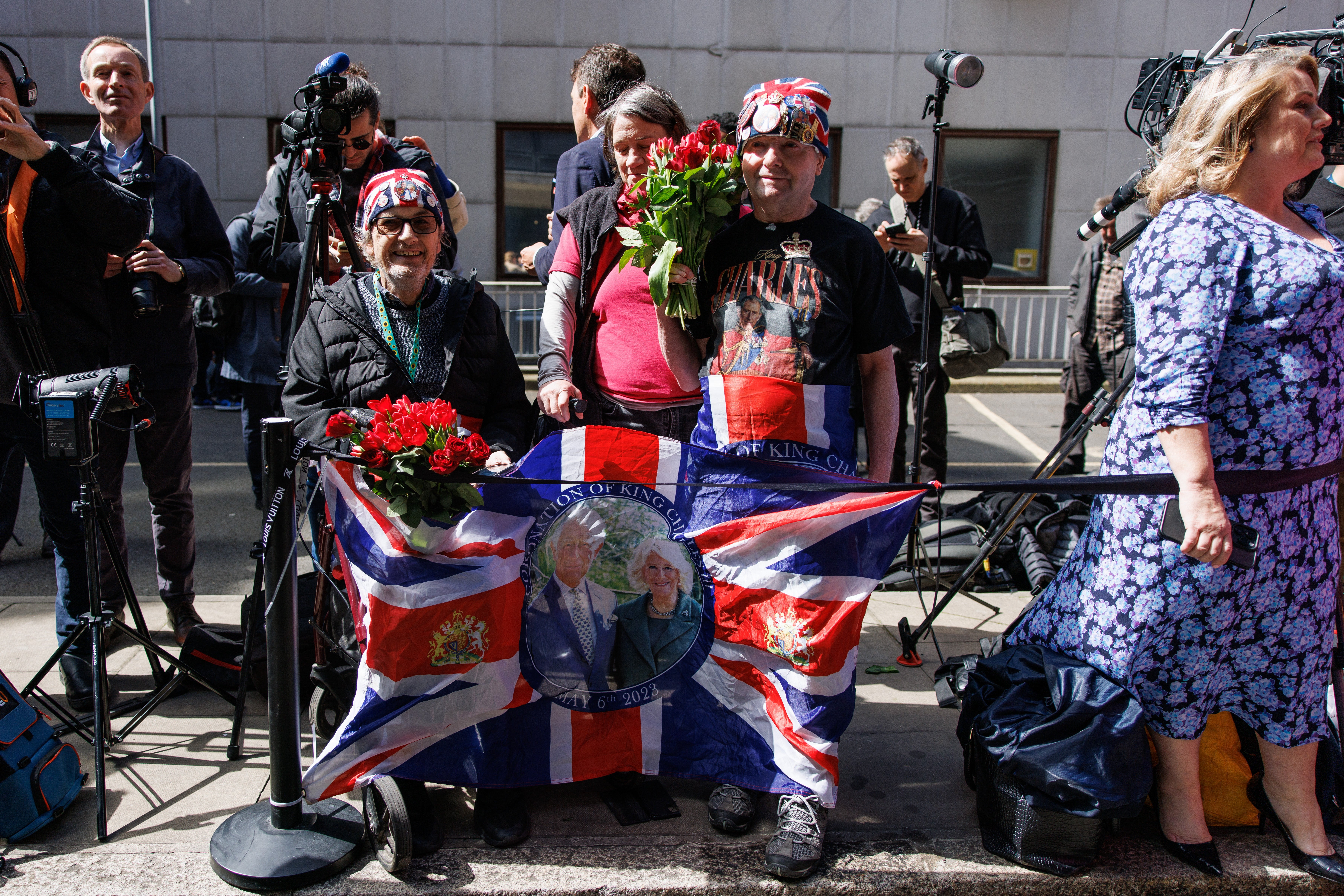 Royal fans John Loughrey (right), 69, and Sky London, 63, wait to greet the King and Queen