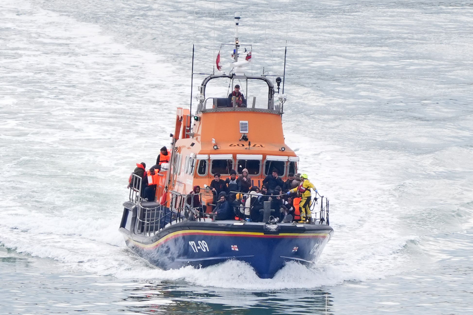 A group of people thought to be migrants are brought in to Dover, Kent, onboard the RNLI Dover Lifeboat following a small boat incident in the Channel (Gareth Fuller/PA)