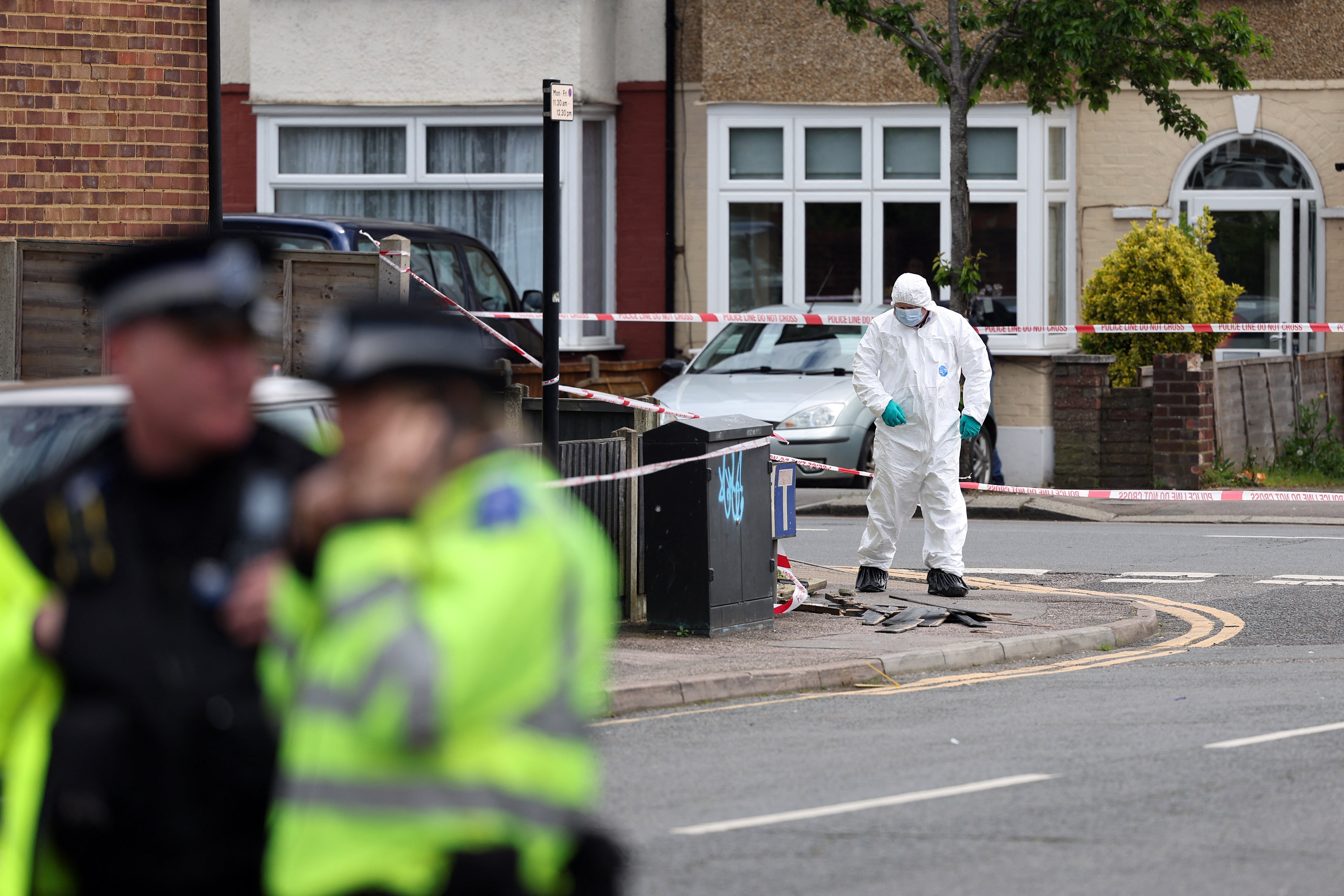 Police officers at the scene in Hainault
