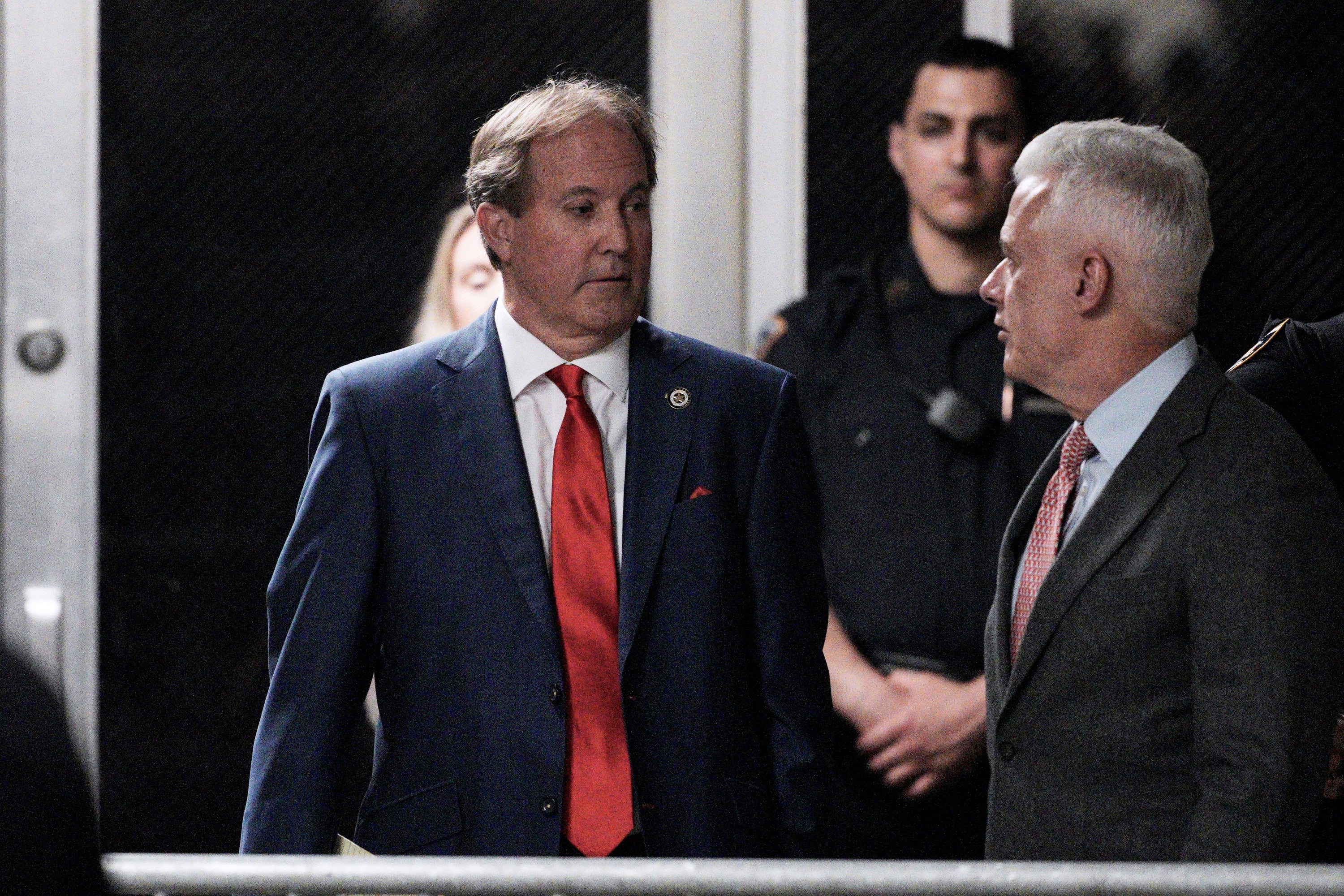 Texas Attorney General Ken Paxton arrives with former president Donald Trump at Manhattan criminal court on Tuesday morning