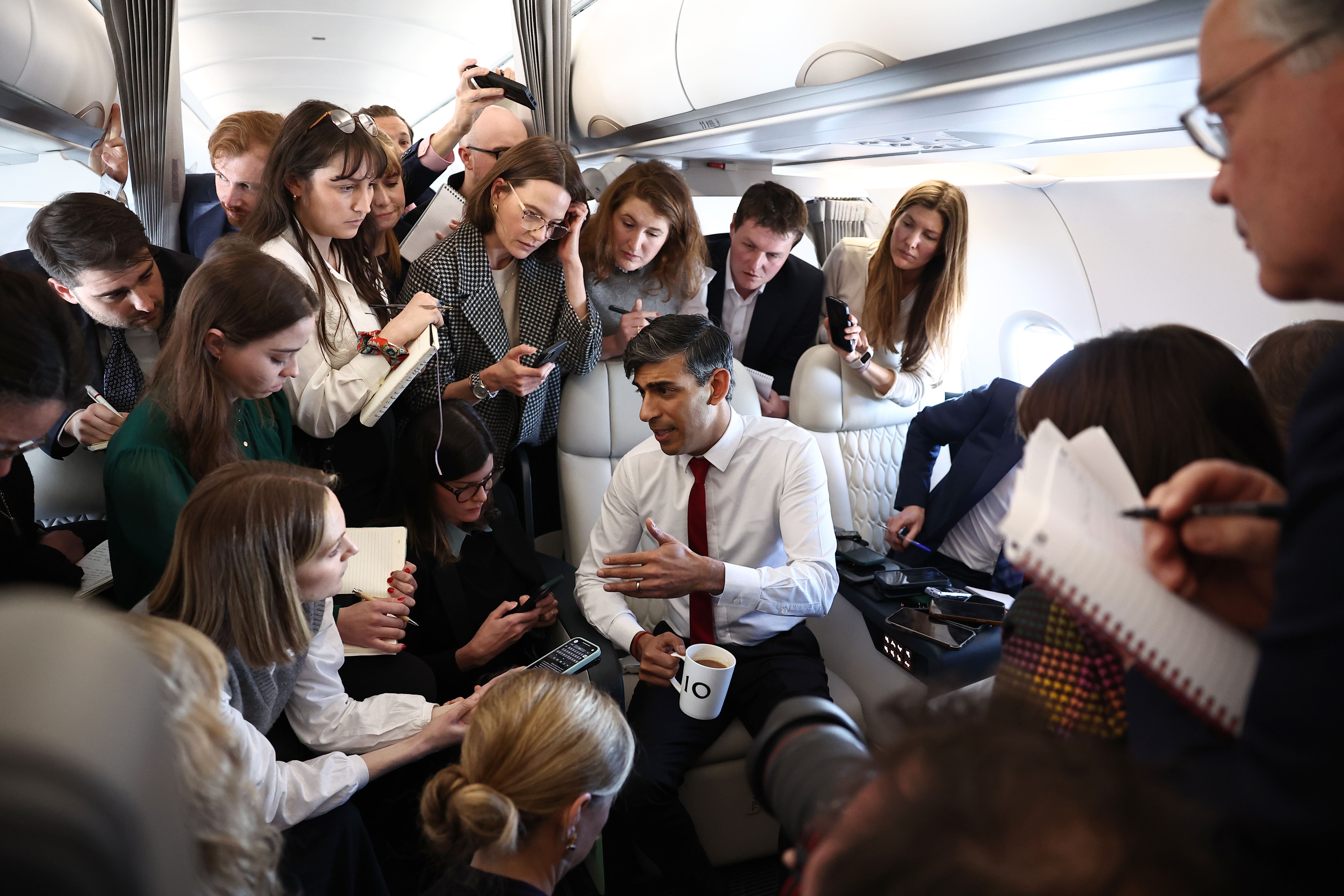 Journalists filing stories during a press huddle with Prime Minister Rishi Sunak (Henry Nicholls/PA)