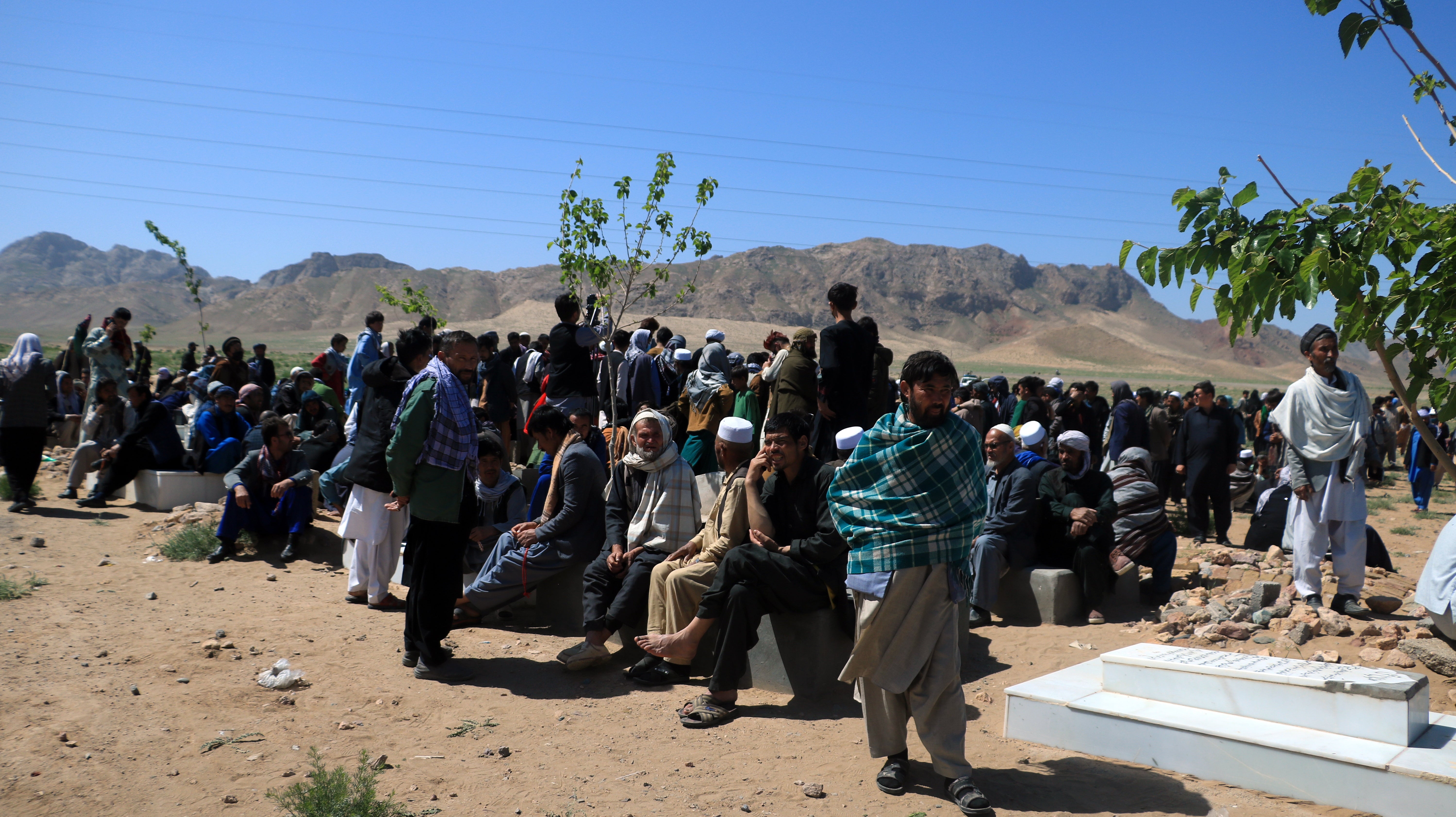 People attend the funeral of a victim of an attack on a Shi'ite Muslim mosque in Herat, Afghanistan,