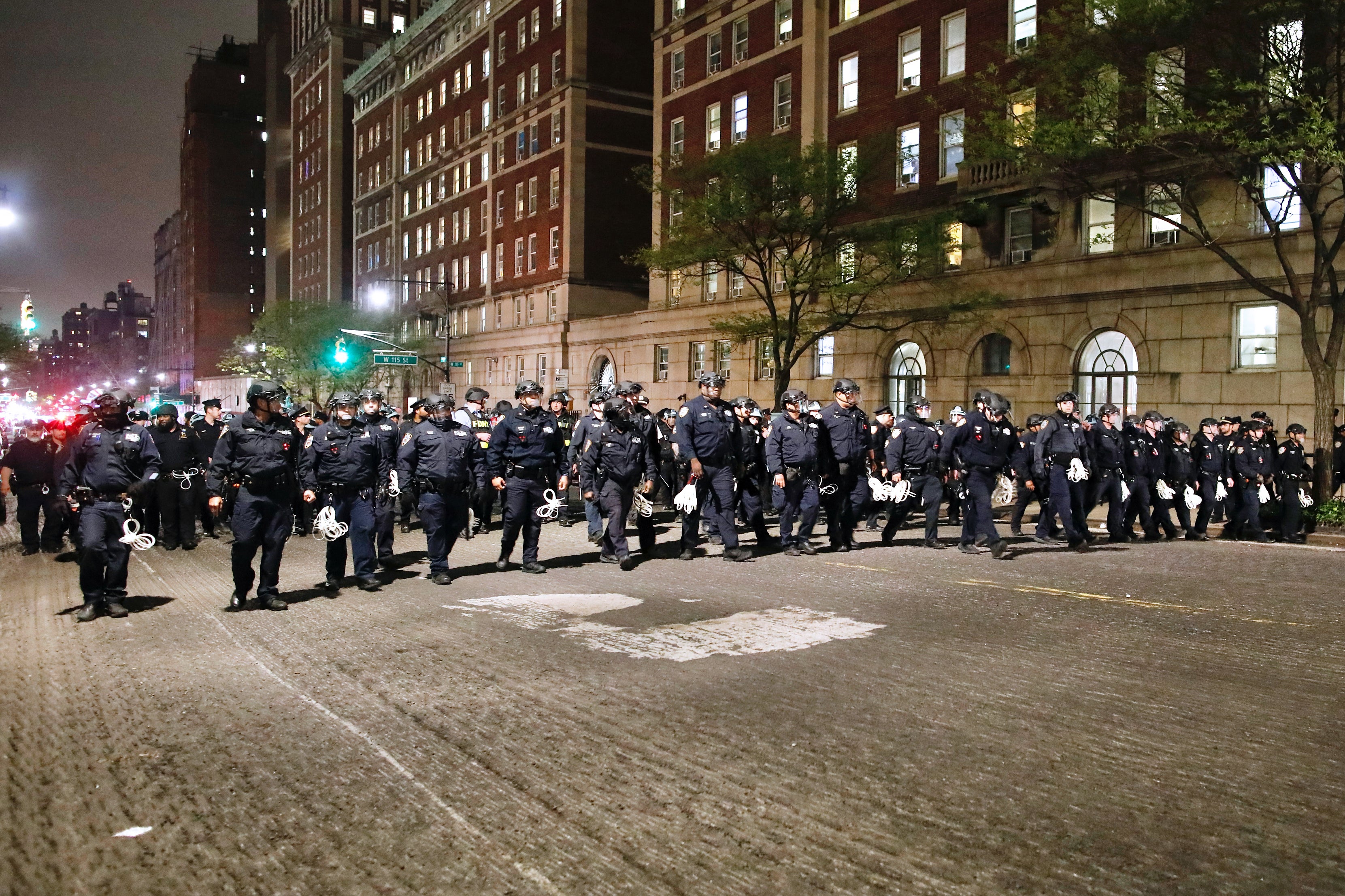 NYPD officers in riot gear march onto Columbia University campus