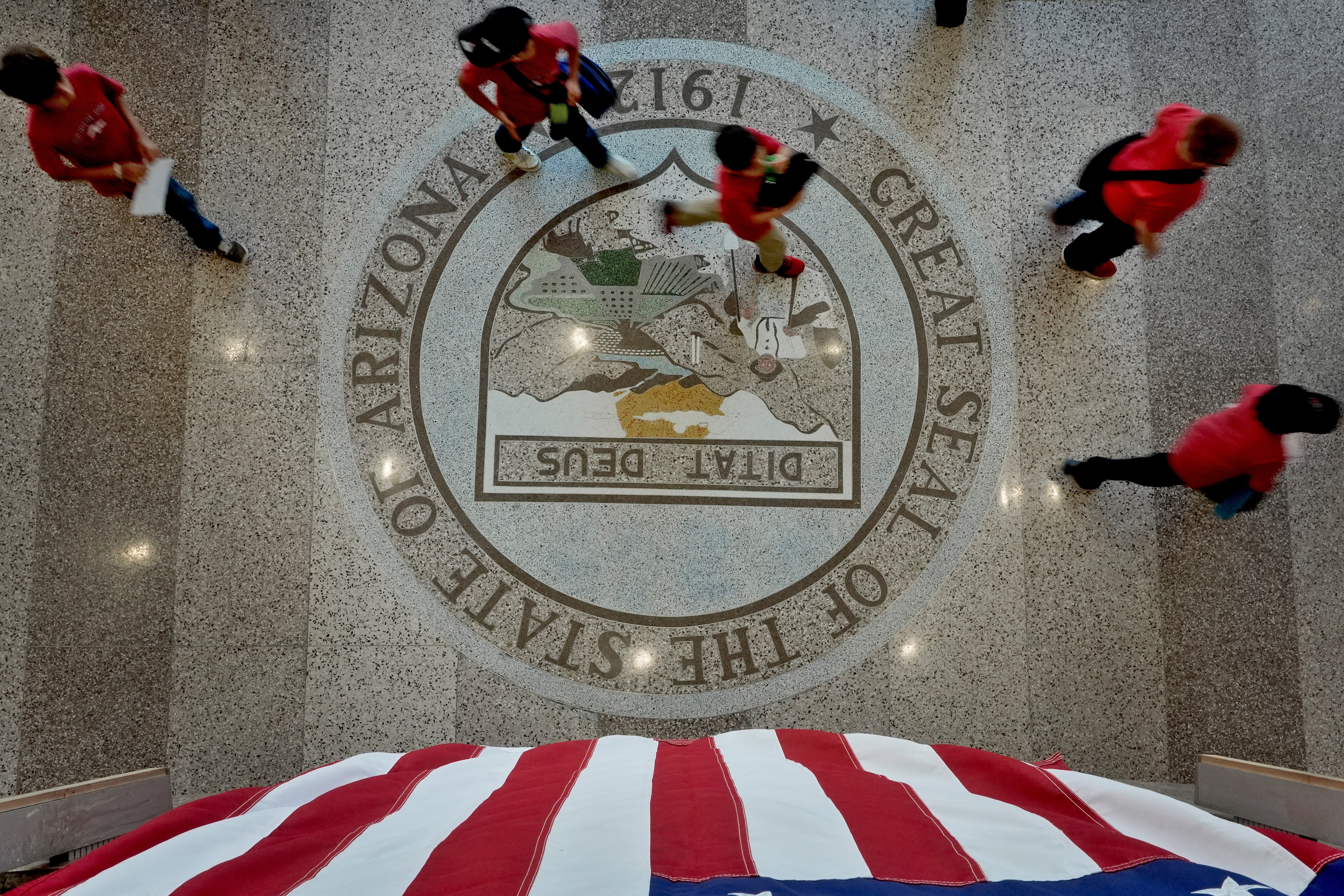 People walk to the Senate gallery to watch the proceedings, Wednesday, May 1, 2024, at the Capitol in Phoenix