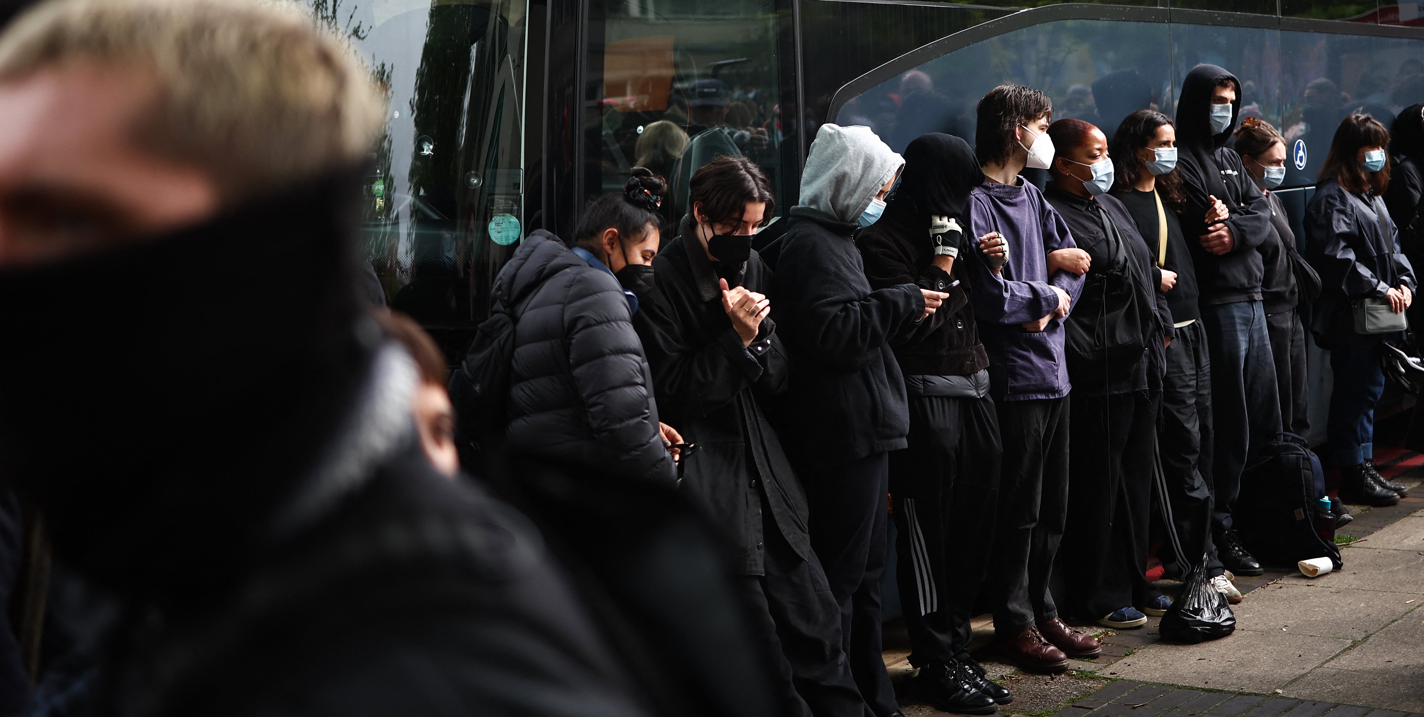 Protesters gather around a bus reportedly waiting to remove migrants and asylum seekers from a hotel in Peckham, south London, last year