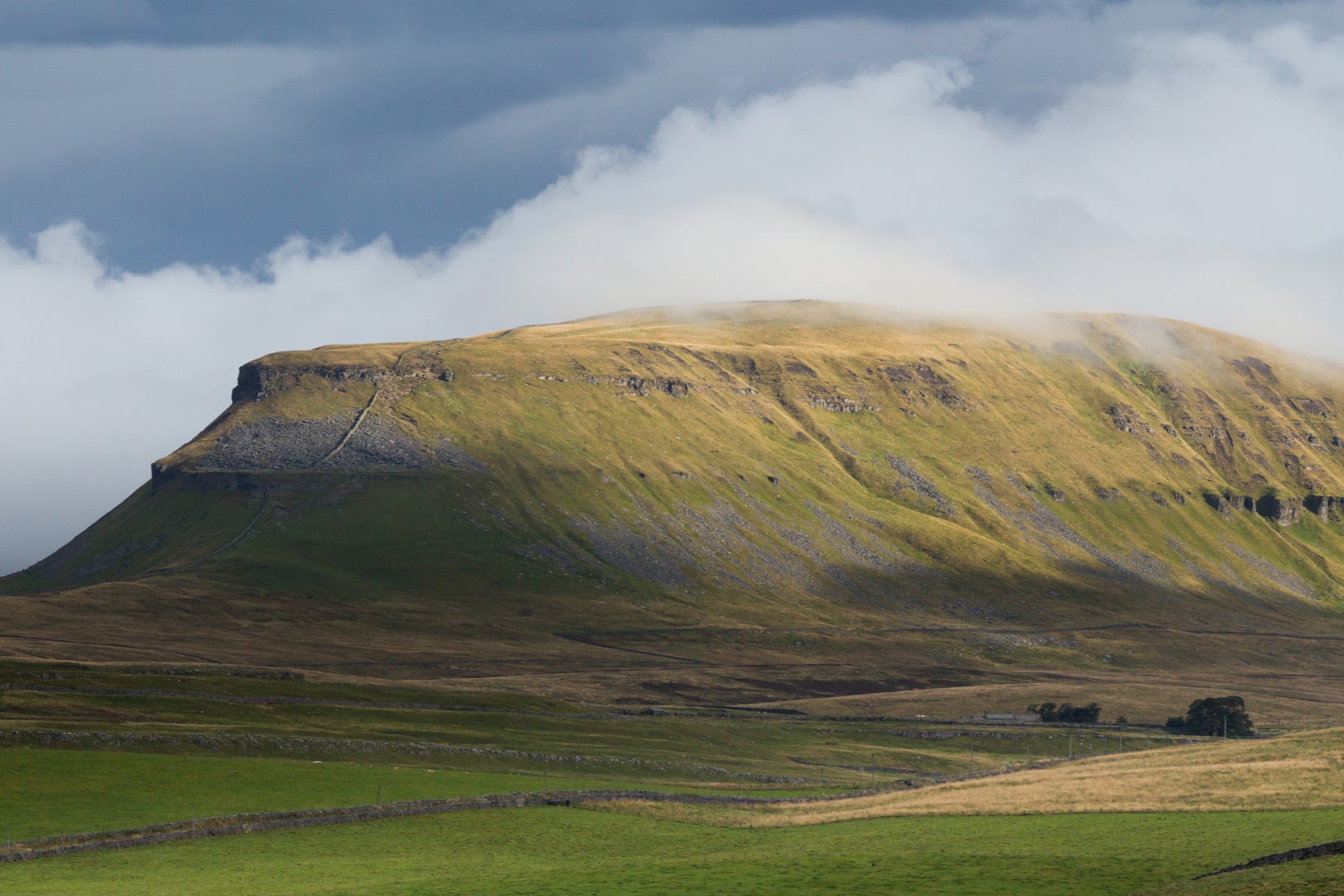 Pen-y-ghent mountain in the early Autumn fog