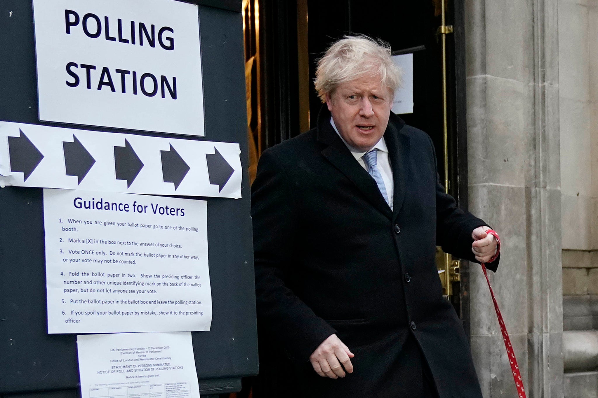 Boris Johnson poses outside Methodist Hall polling station.