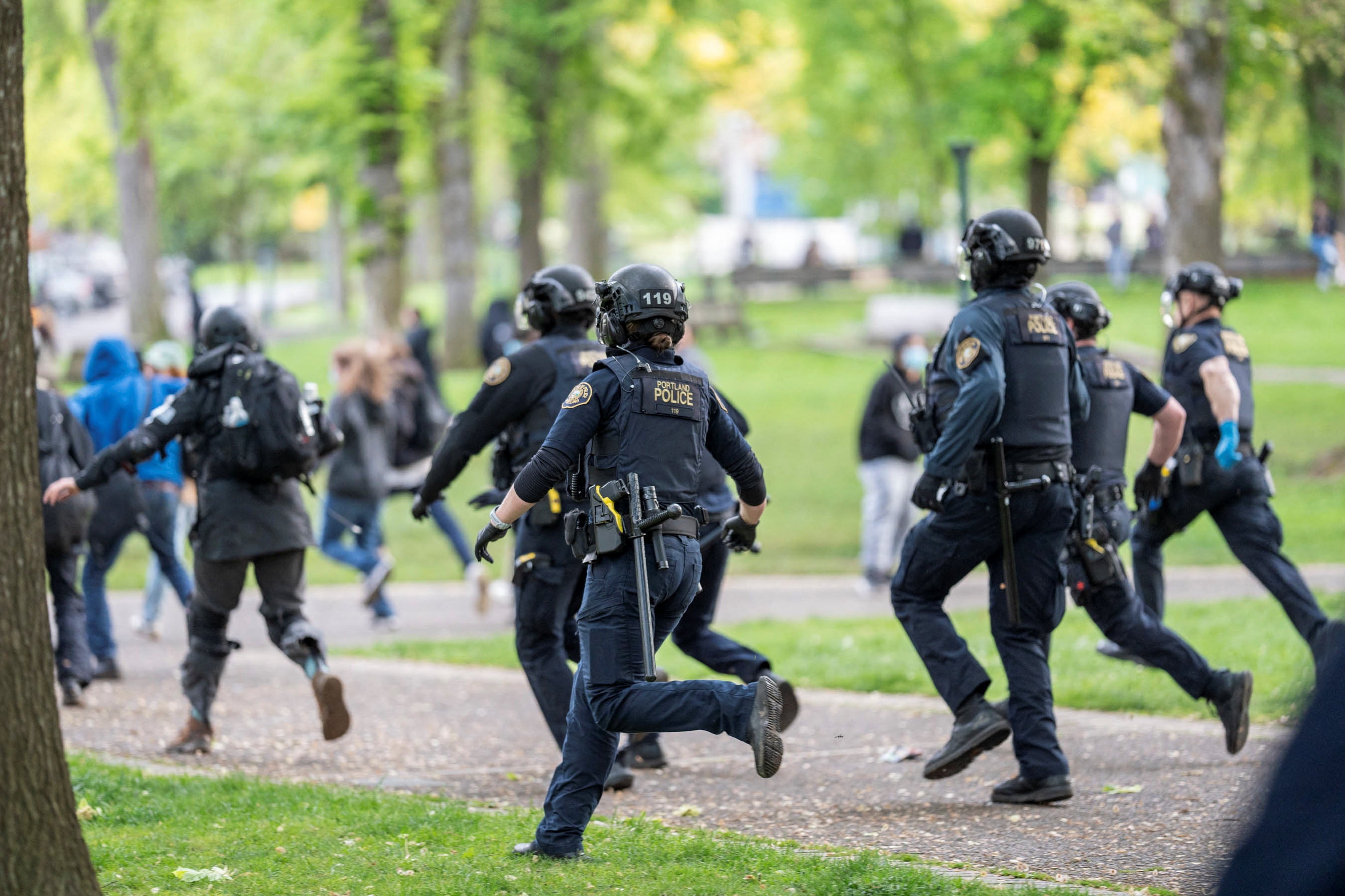 Portland Police chase protesters who re-occupied the Portland State University Library building after it had been cleared and several protesters detained earlier in the day, during the ongoing conflict between Israel and the Palestinian Islamist group Hamas, in Portland, Oregon, U.S., May 2, 2024