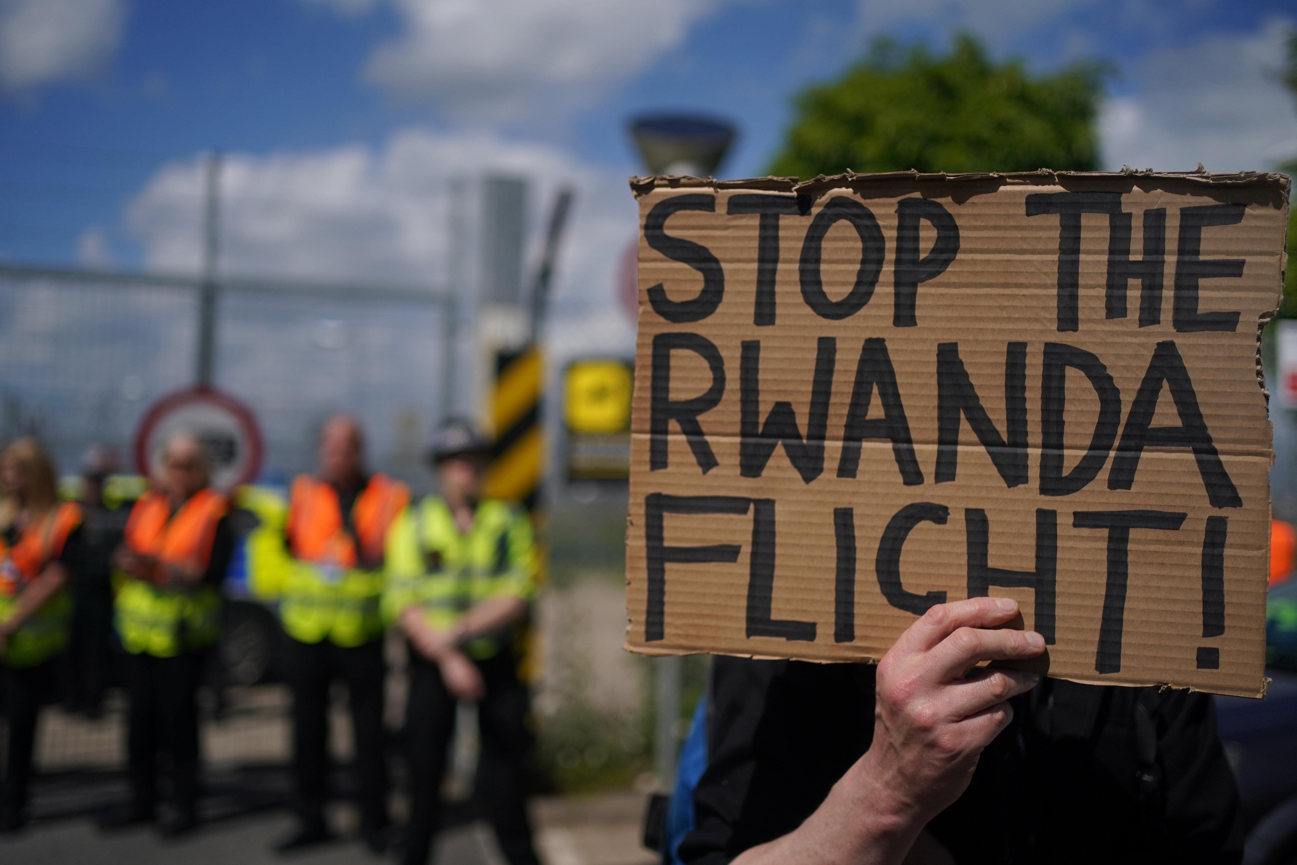 Demonstrators at a removal centre at Gatwick protest against plans to send migrants to Rwanda (PA)