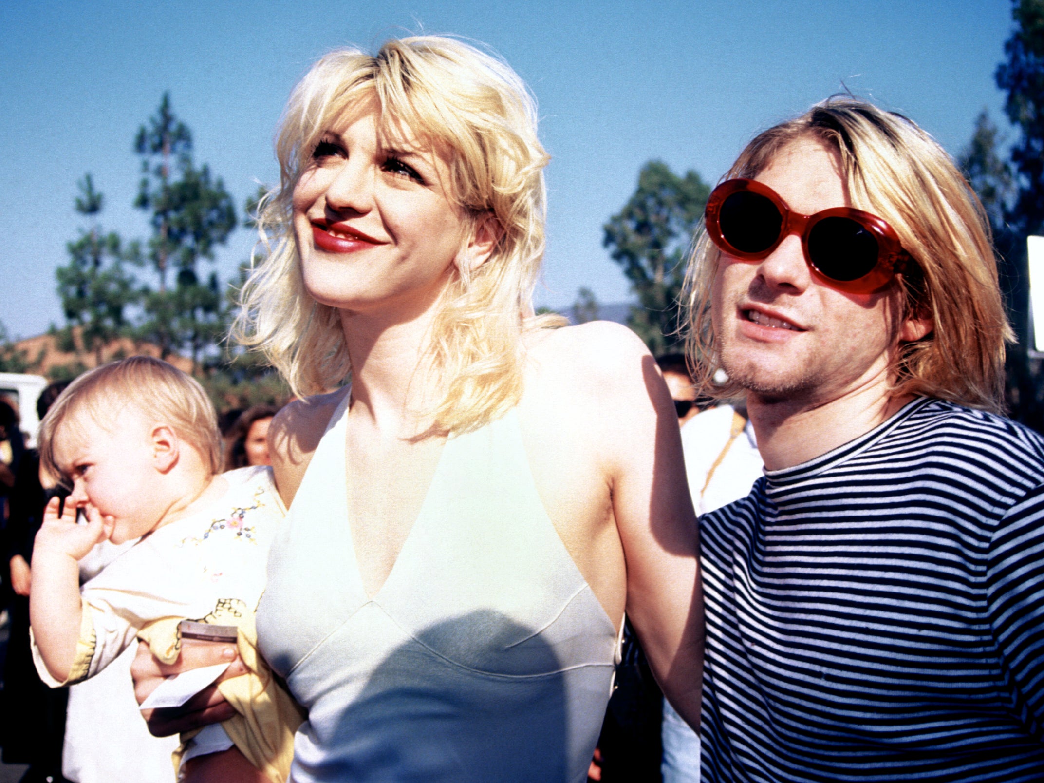 Cobain with his wife Courtney Love and daughter Frances Bean at the 1993 MTV Awards in LA