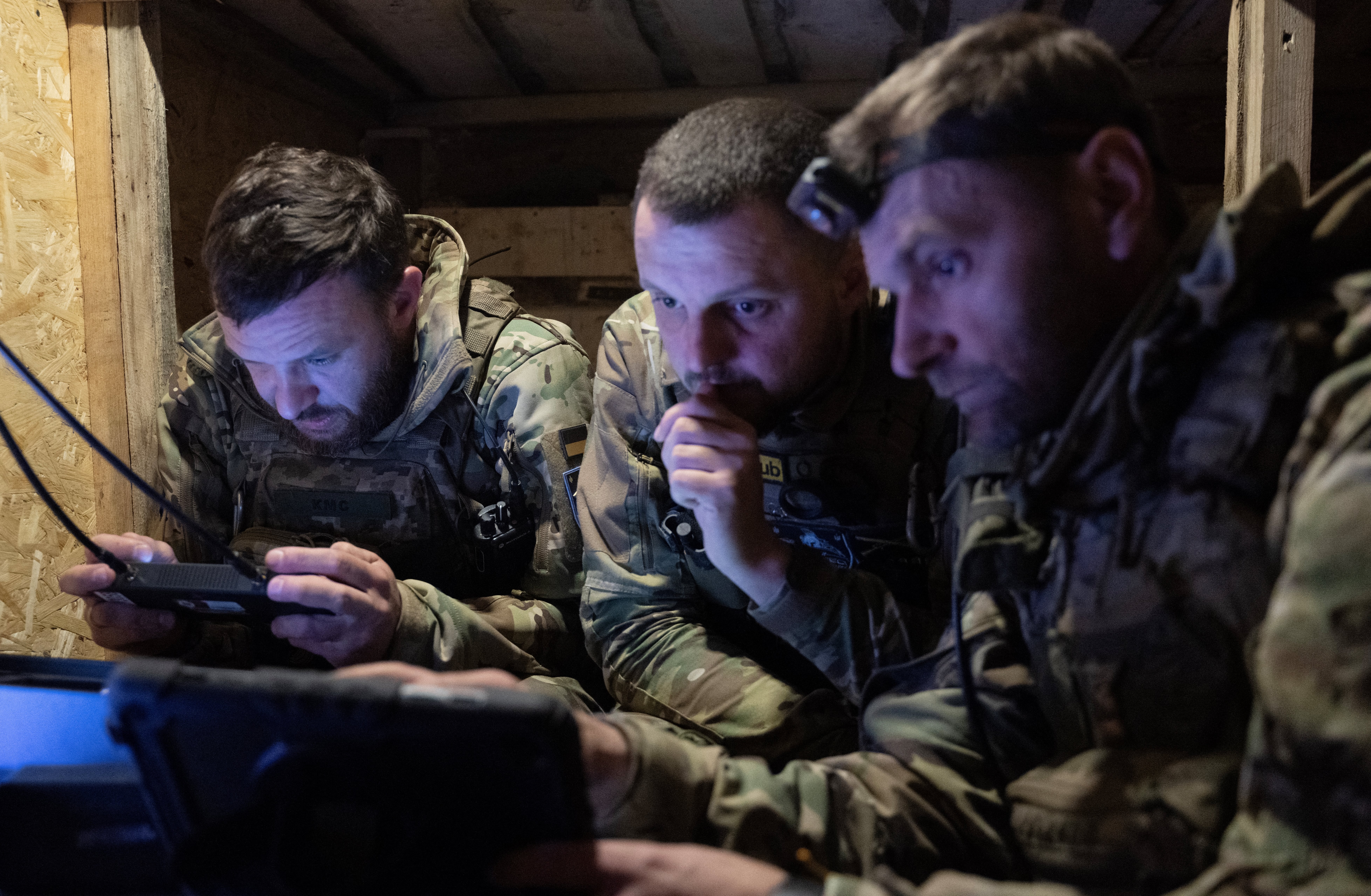 Servicemen of the ‘Achilles’ Battalion from the 92nd Assault Brigade of the Ukrainian army control a Vampire hexacopter drone during a mission flight over a front line near Chasiv Yar