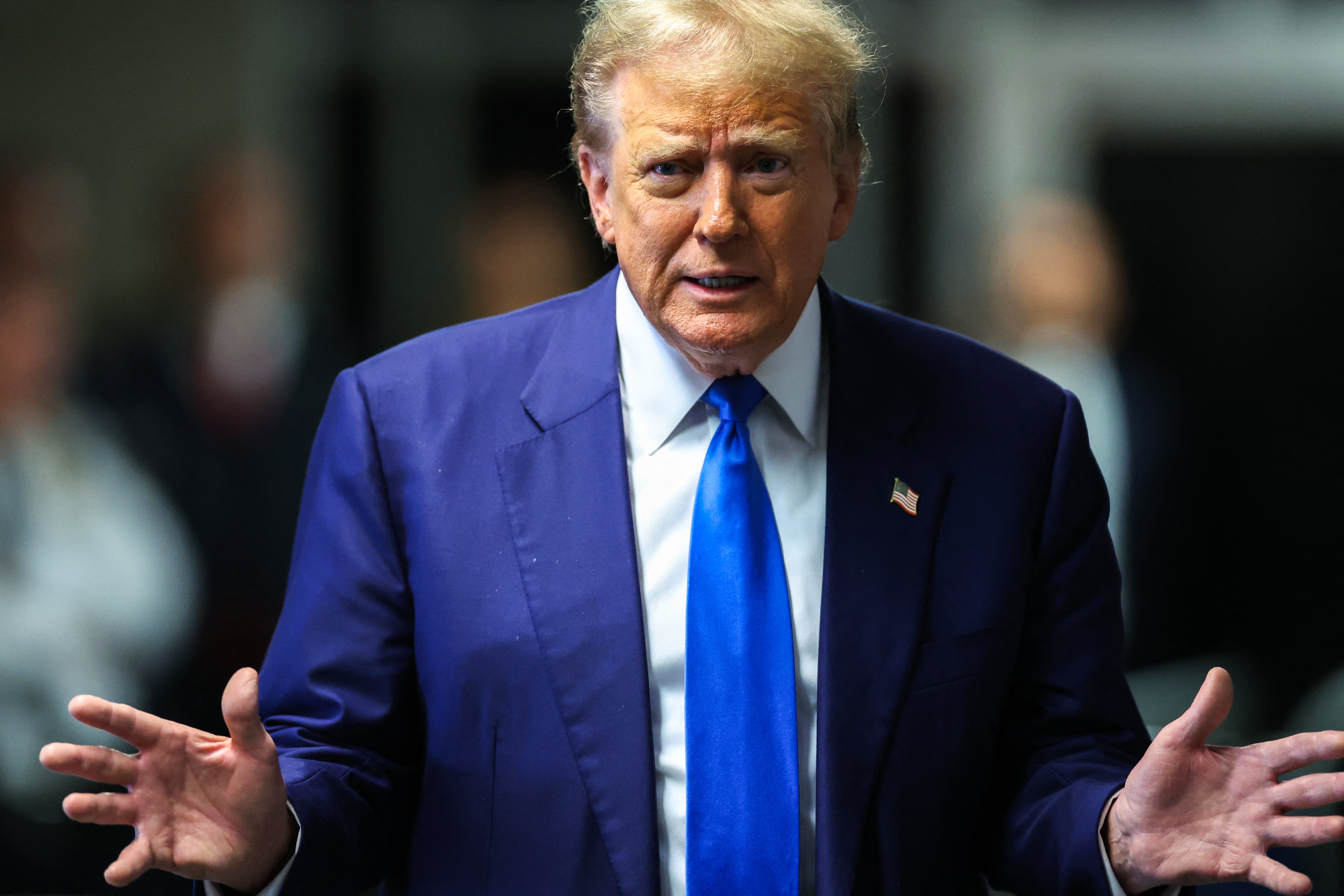 Donald Trump speaks to reporters inside a criminal courthouse in Manhattan on 3 May.