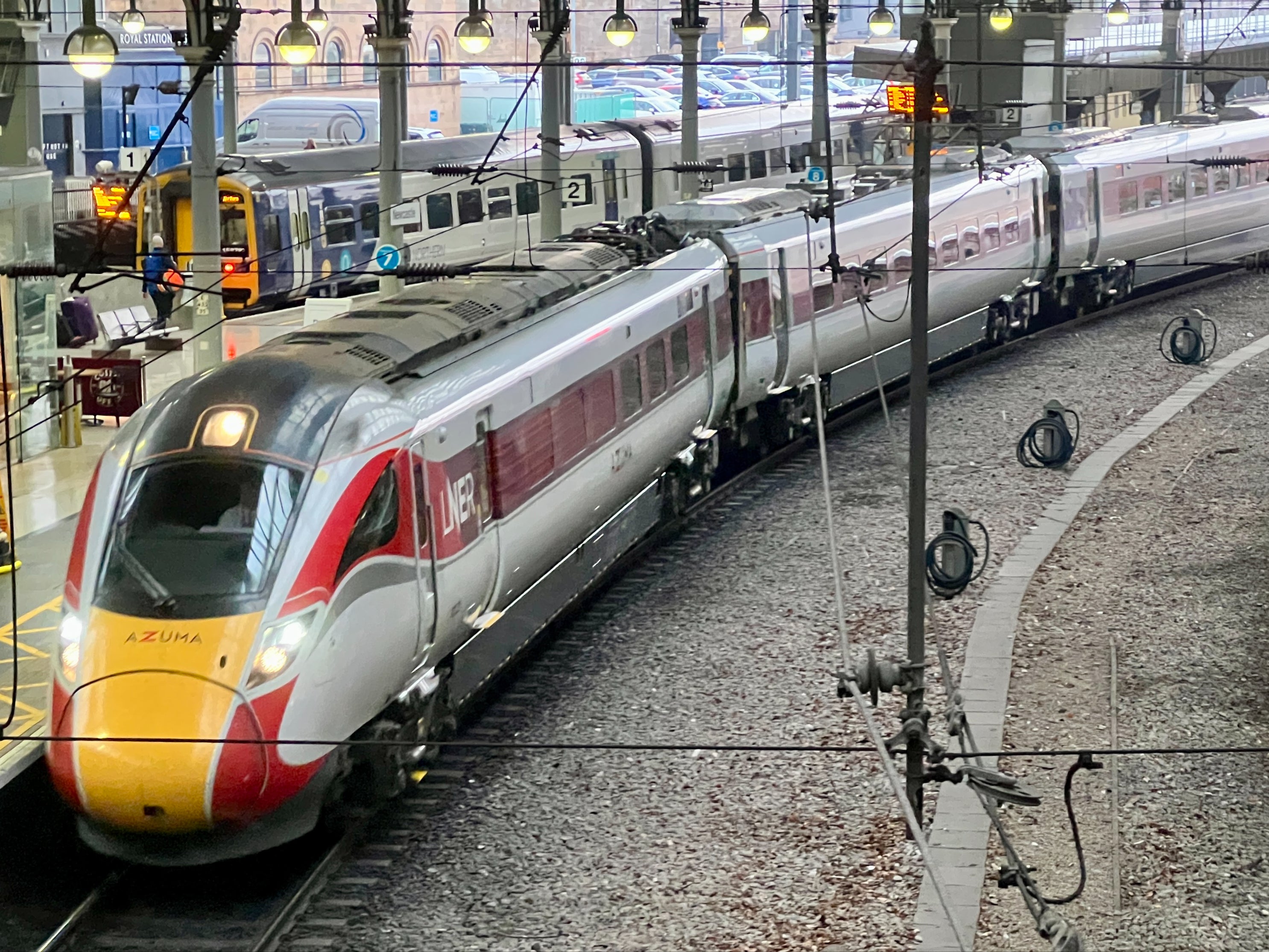 LNER Azuma express at Newcastle station, with a Northern train in the background