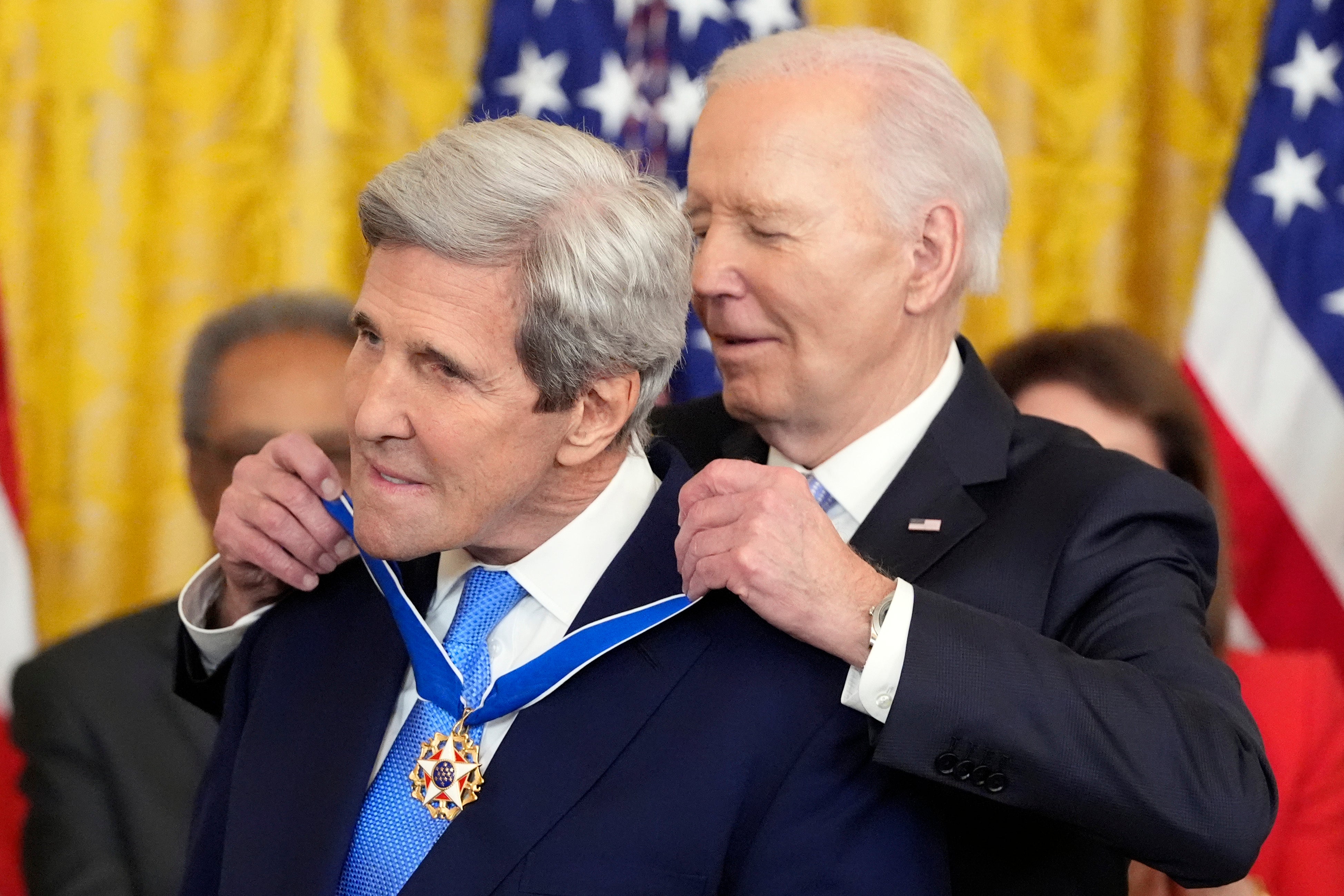 President Joe Biden awards the nation's highest civilian honor, the Presidential Medal of Freedom, to former Secretary of State John Kerry during a ceremony in the East Room of the White House, Friday, May 3, 2024, in Washington. (AP Photo/Alex Brandon)