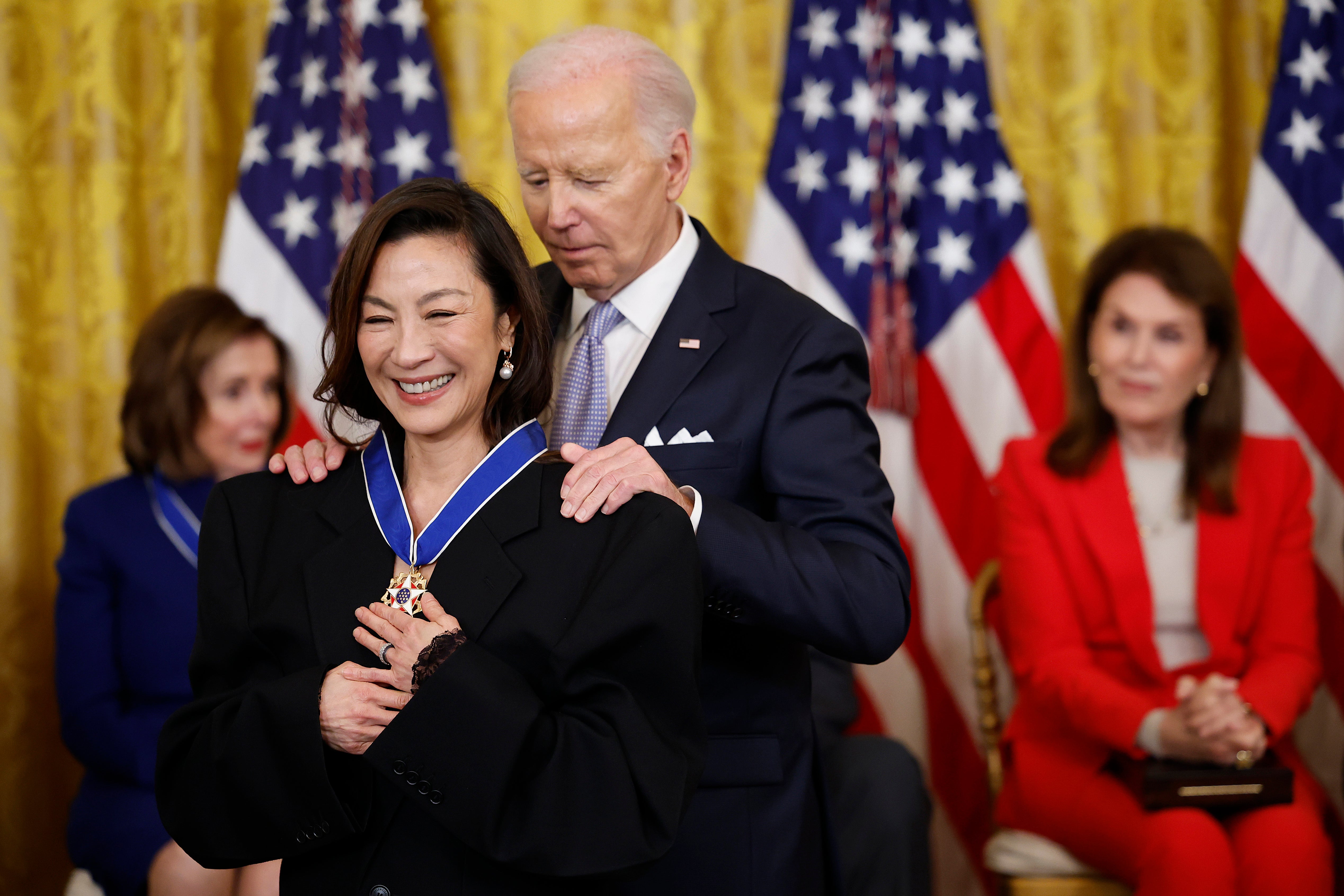 Joe Biden awards the Medal of Freedom to Actress Michelle Yeoh during a ceremony in the East Room of the White House on May 3, 2024 in Washington, DC