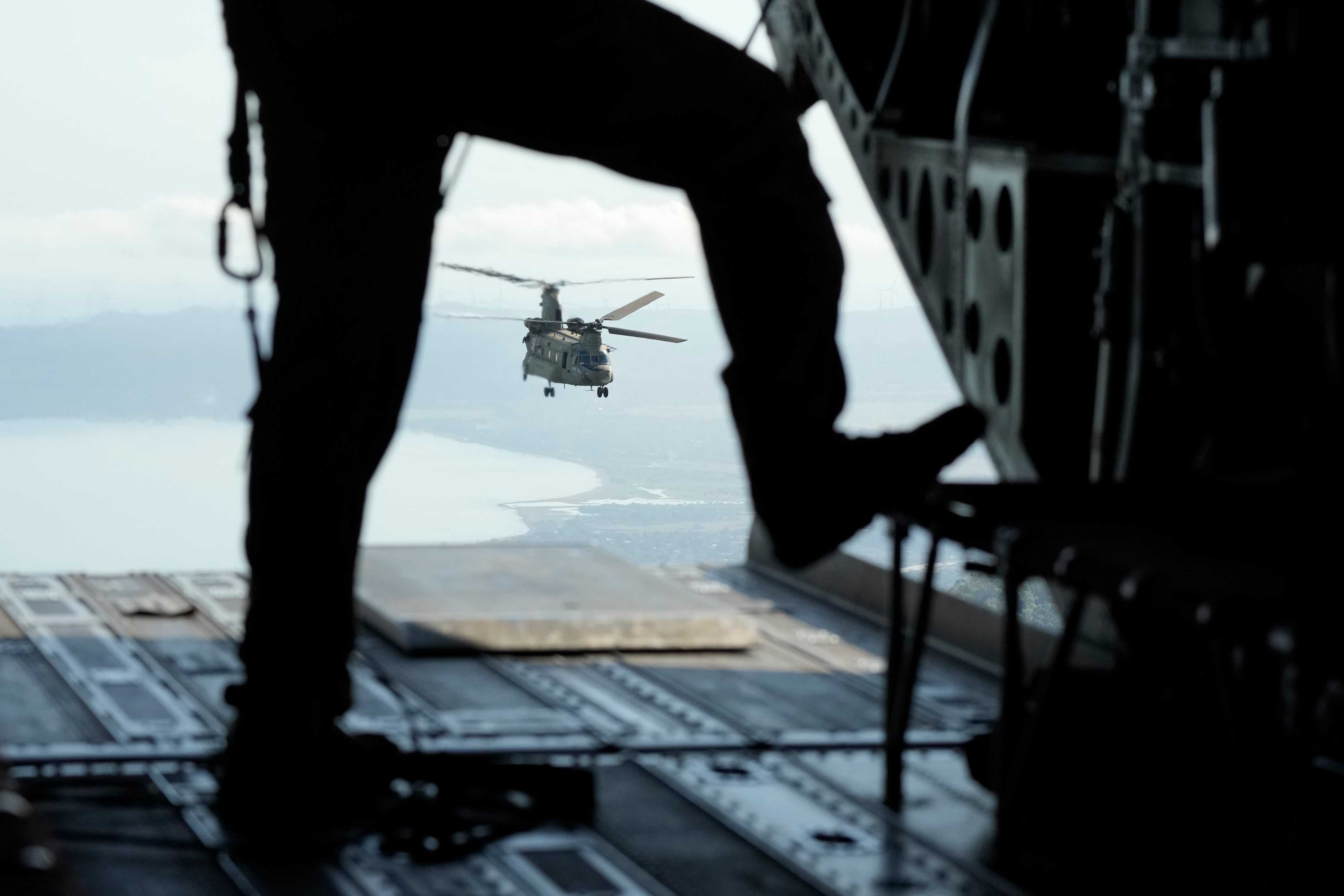 A US military helicopter flies over Ilocos Norte province during a joint military exercise in the northern Philippines