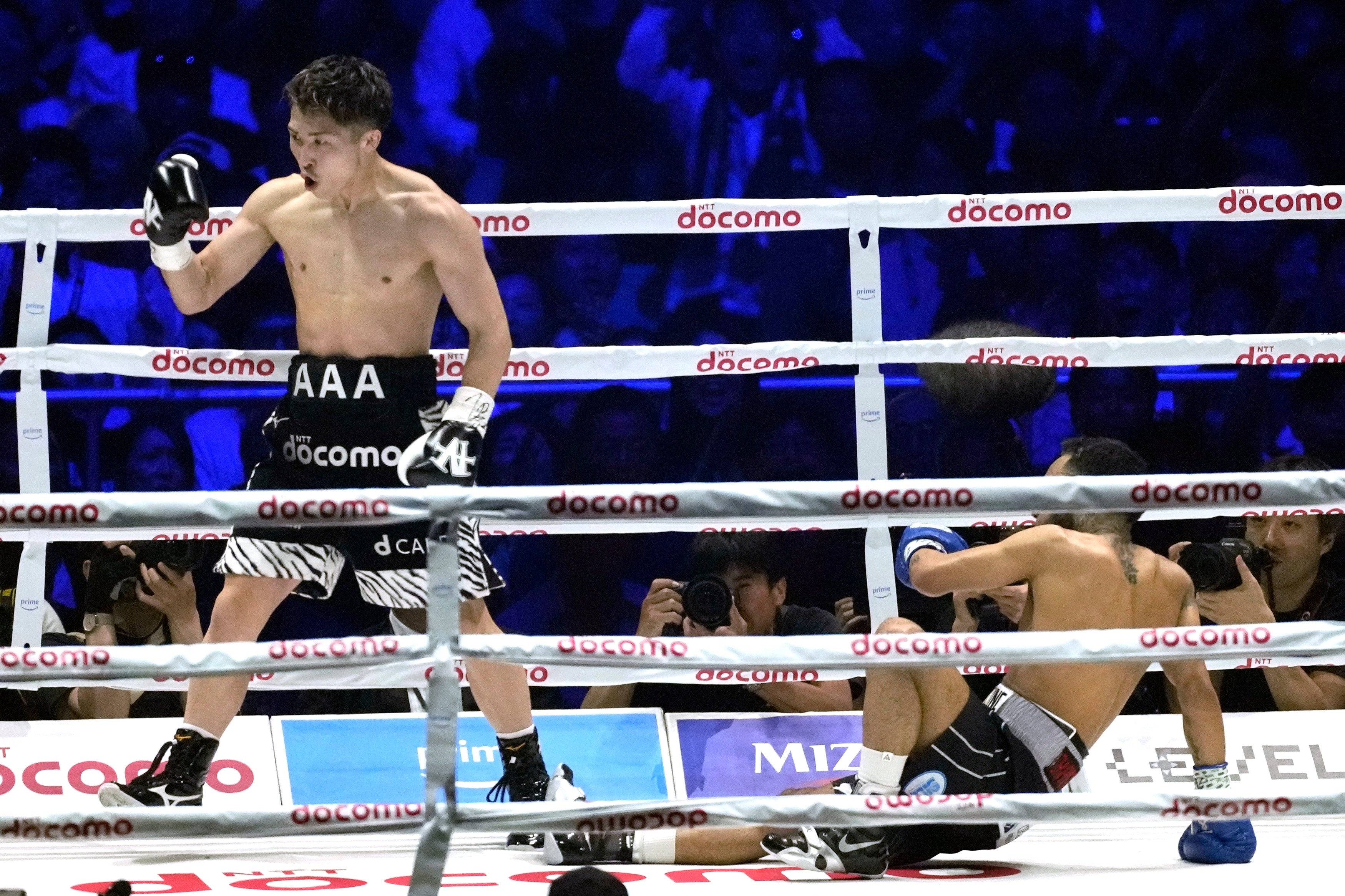 Inoue celebrates knocking down Luis Nery during their fight in May