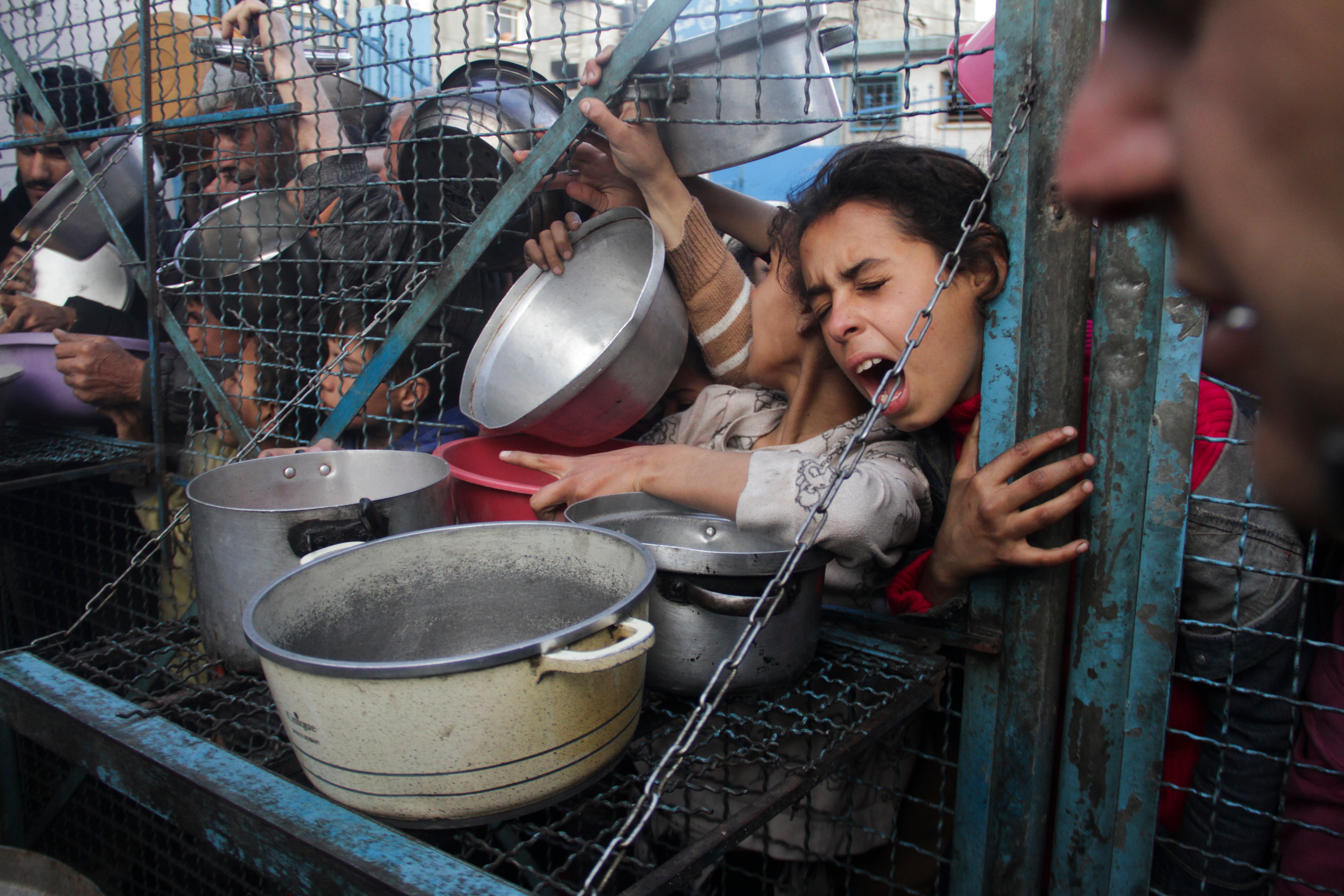 Palestinians line up to receive meals at Jabaliya refugee camp in the Gaza Strip in March. The head of the United Nations World Food Programme says northern Gaza has entered “full-blown famine” after nearly seven months of war between Israel and Hamas