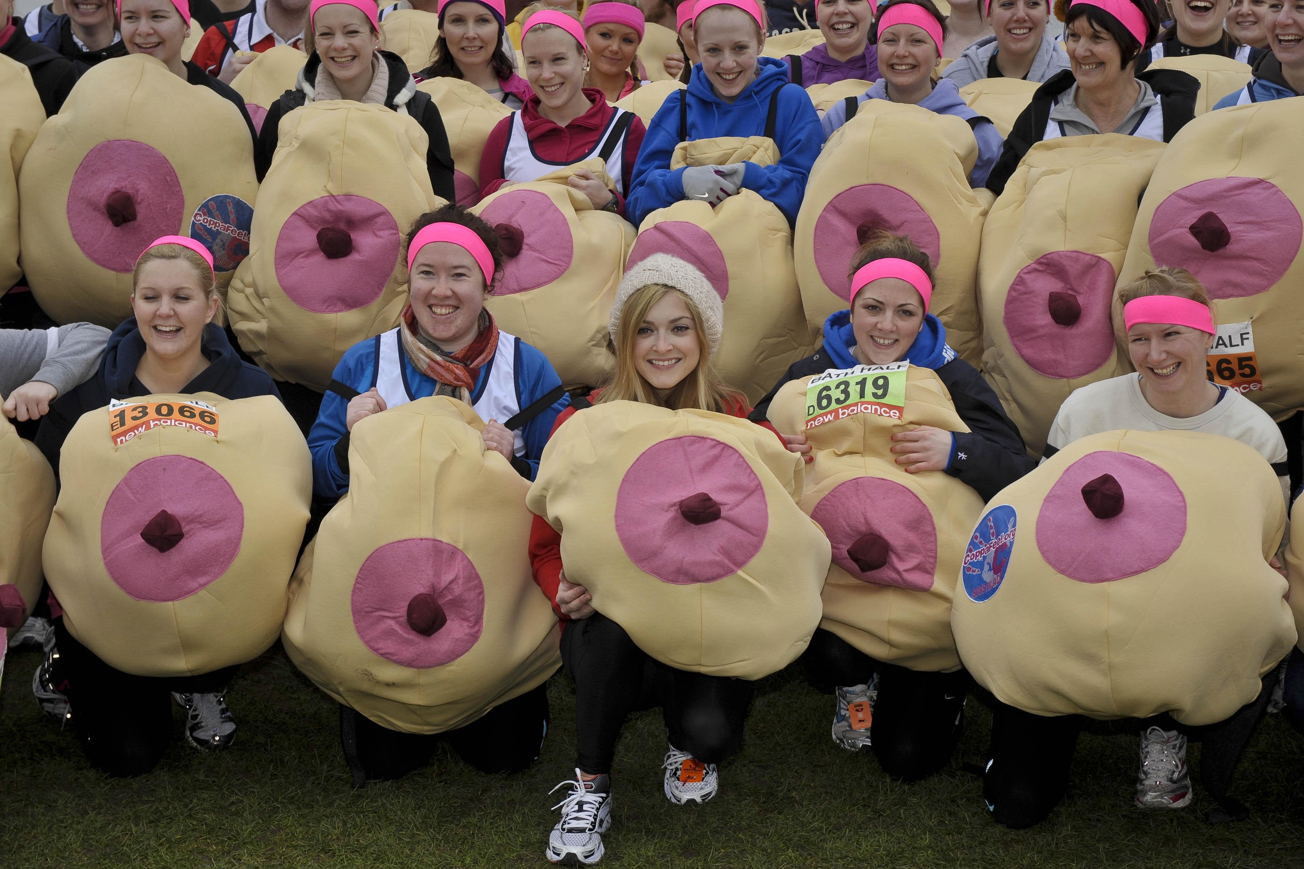 TV presenter Fearne Cotton (front centre) joins supporters of breast cancer charity CoppaFeel!, wearing giant boob costumes as they wait to take part in the Bath Half Marathon, where 100 supporters are taking part to raise money for the cancer charity (Ben Birchall/PA)