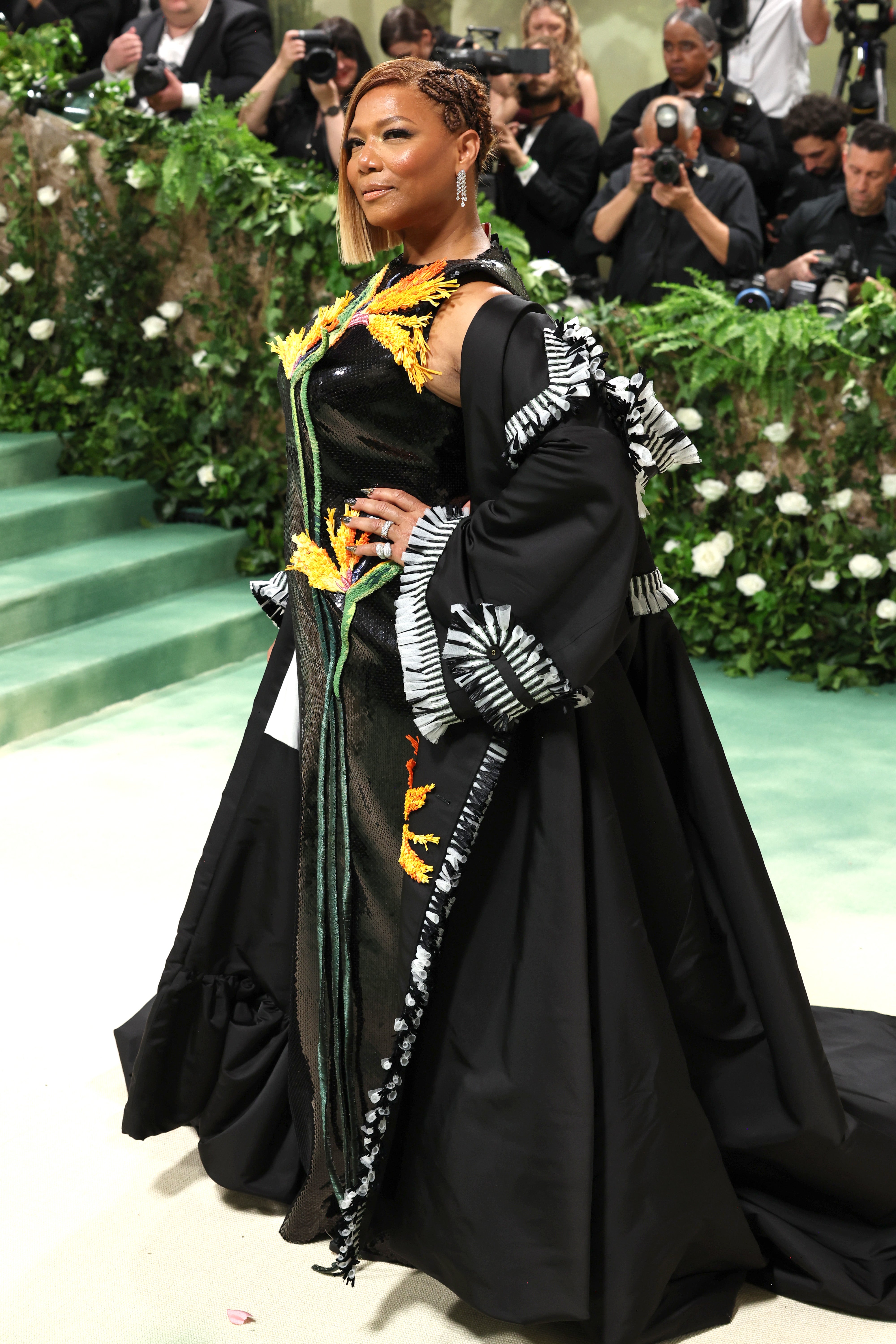 Queen Latifah attends her first Met Gala in custom Thom Browne