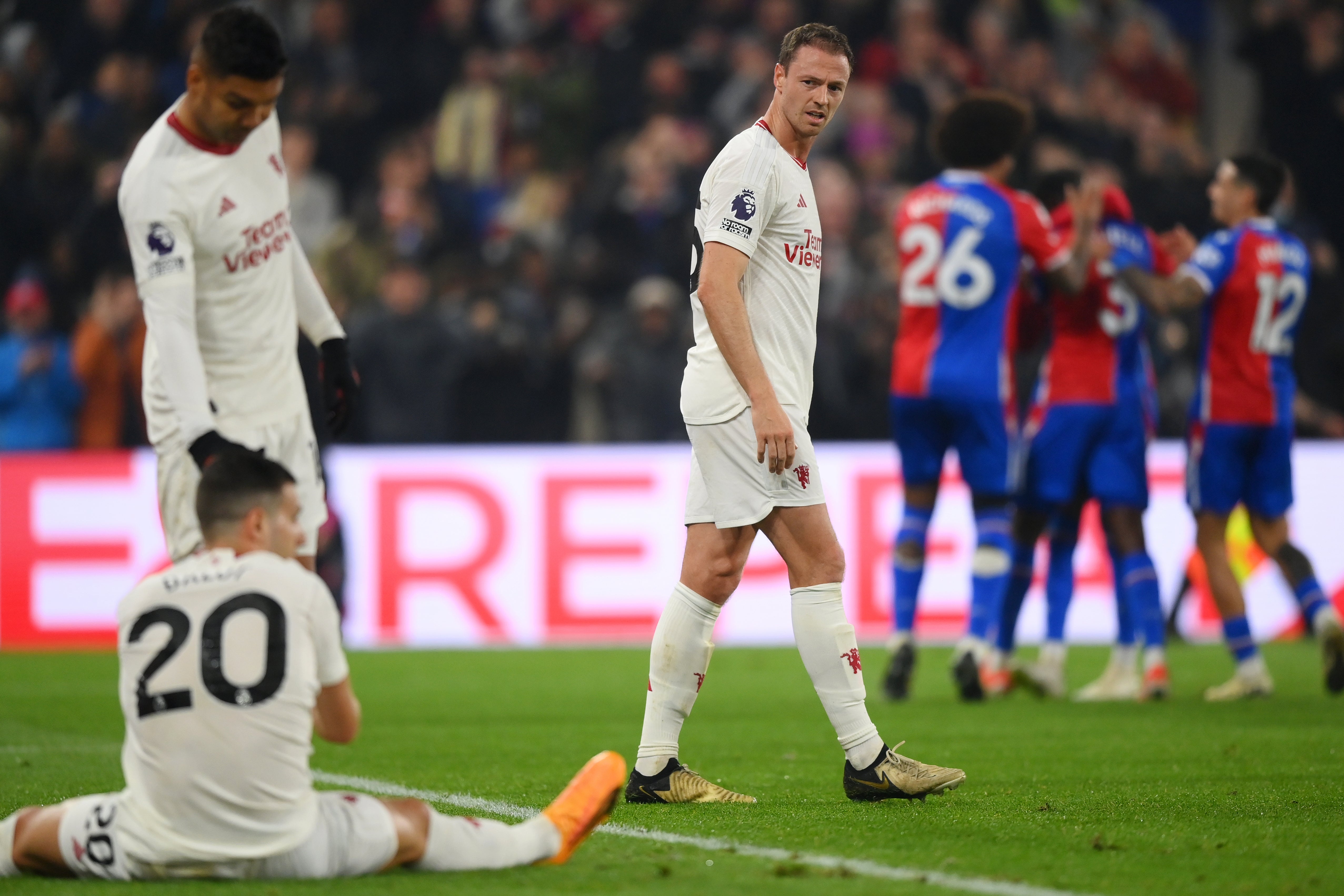 Jonny Evans of Manchester United looks dejected