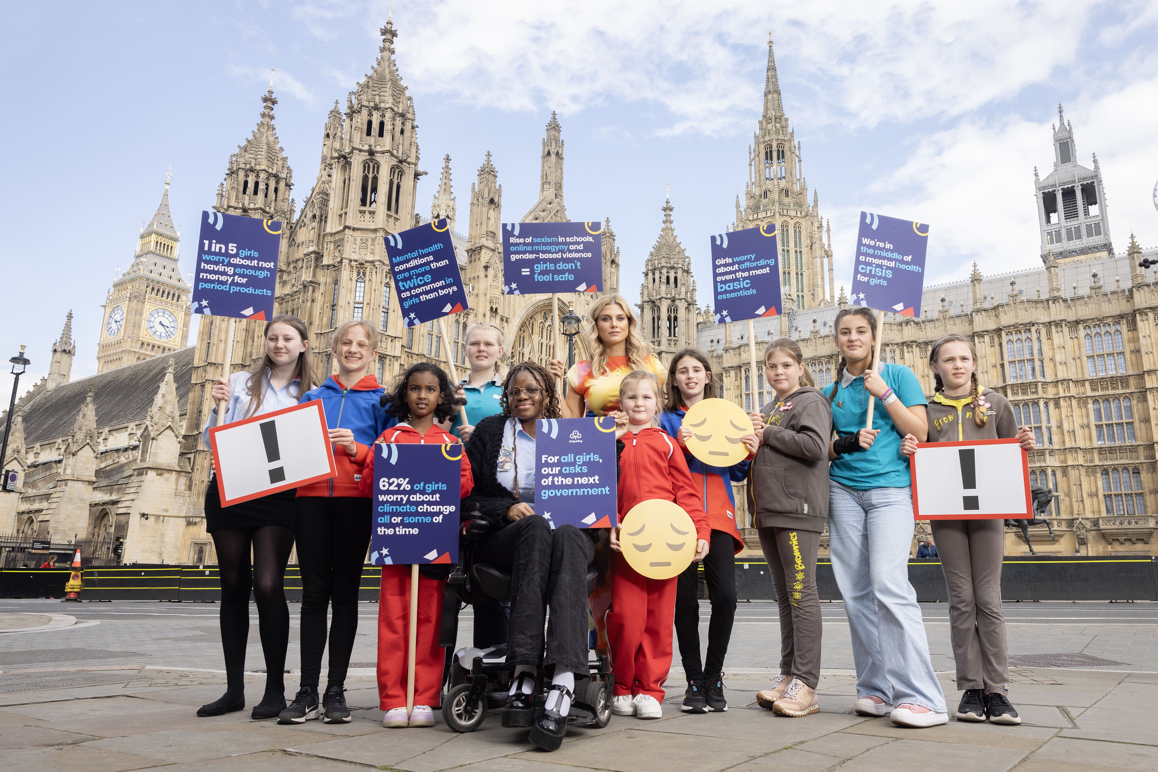 Television presenter Ashley James with Girlguiding members (left-right) Erin (16), Harriet (12), Sofia (6), Tegan (14), Hilary (18), Olivia (6), Molly (12), Leah (8), Amelia (14) and Agnes (8) as the UK’s largest youth organisation dedicated to girls has set out how the next government should better prioritise the needs, happiness and safety of girls and young women (Matt Alexander Assignments/PA)