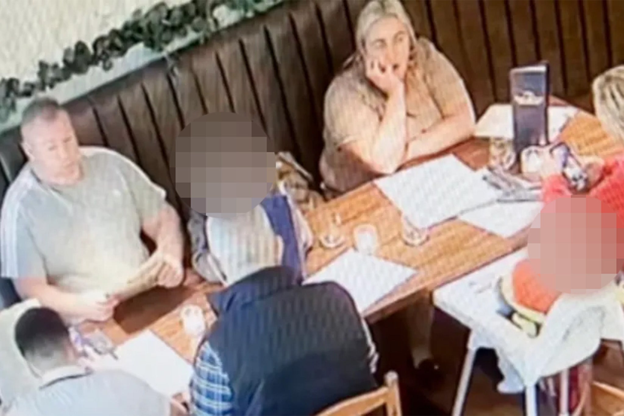 The family was caught on CCTV at Bella Ciao in Swansea