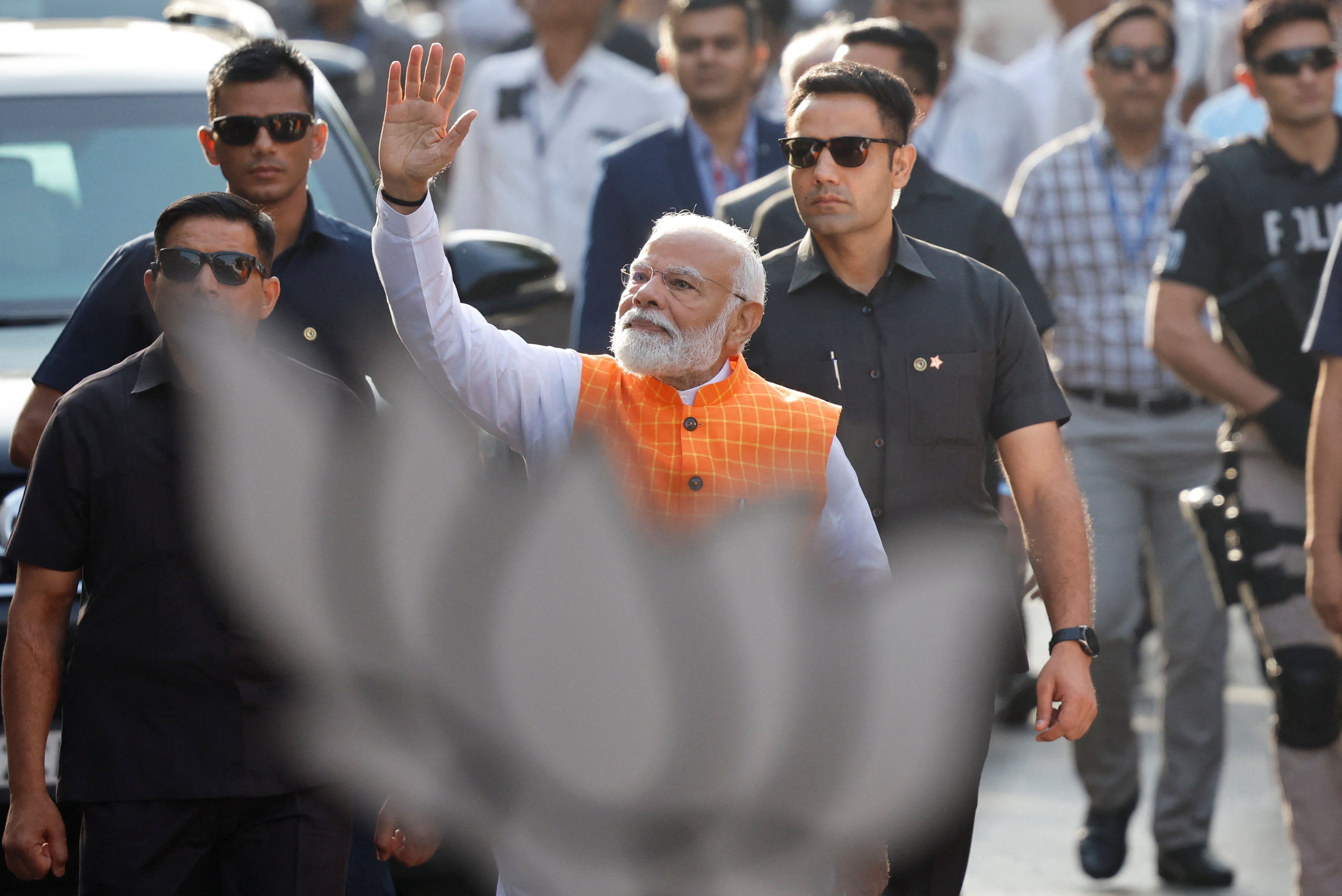 India's prime minister Narendra Modi waves on the day he votes during the third phase of the general election, in Ahmedabad