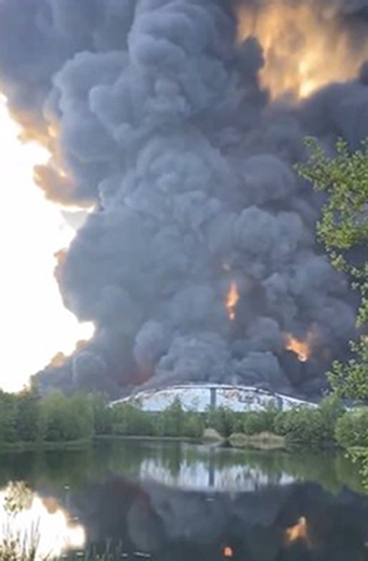 Smoke seen billowing into the sky from the warehouse