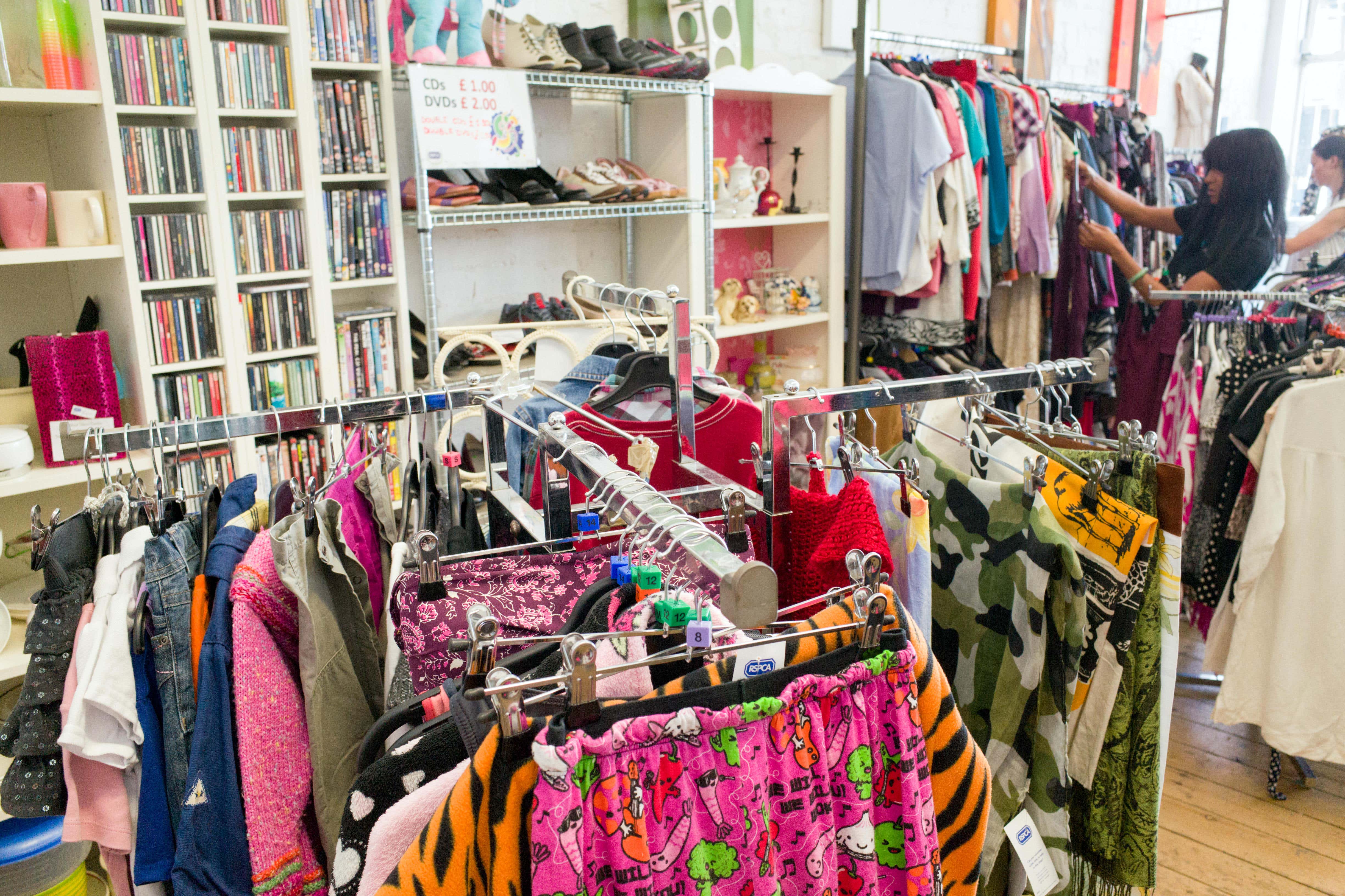 Secondhand clothes in a charity shop in London (Alamy/PA)