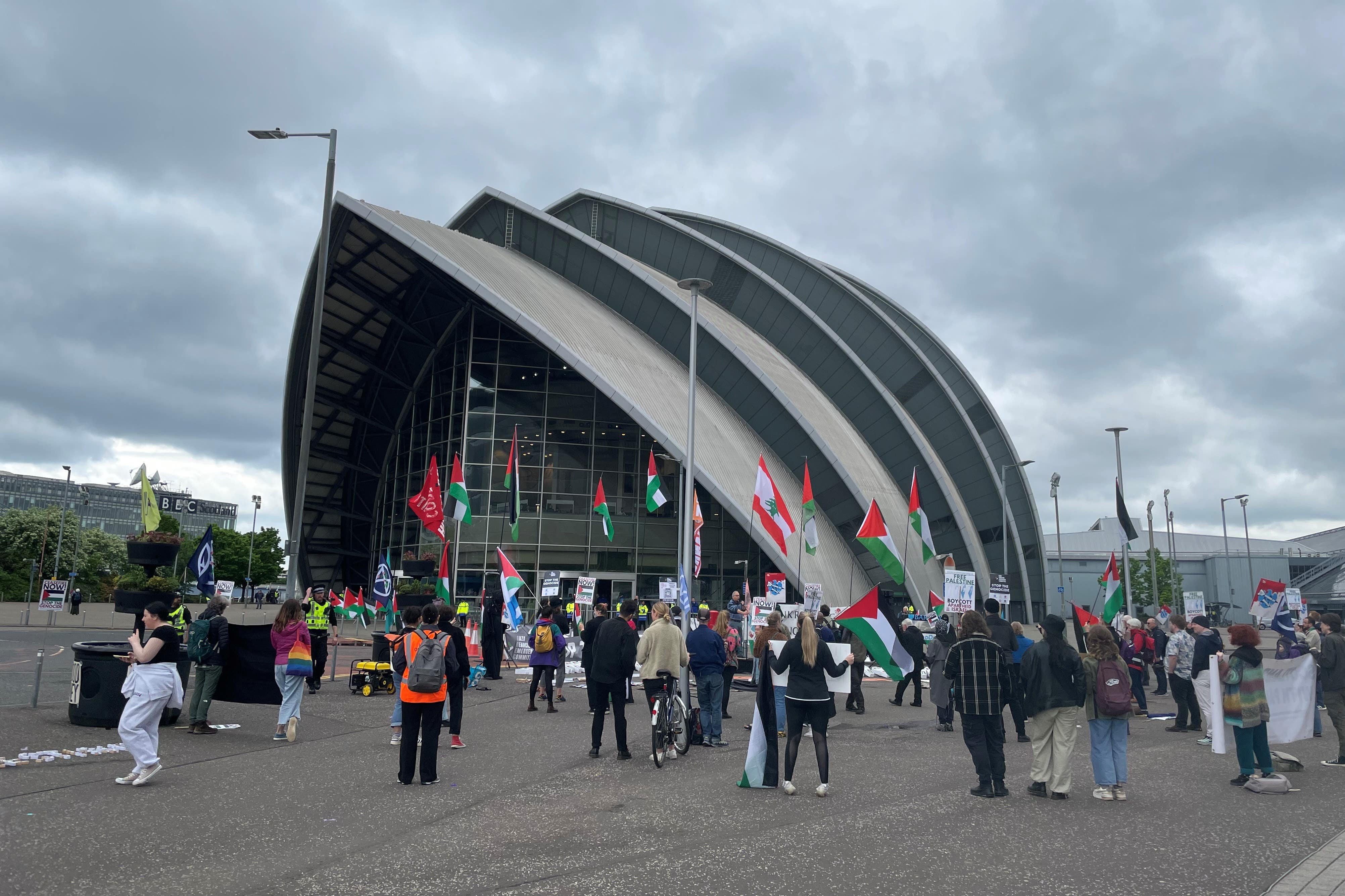 Protesters outside the Barclays AGM in Glasgow (PA)