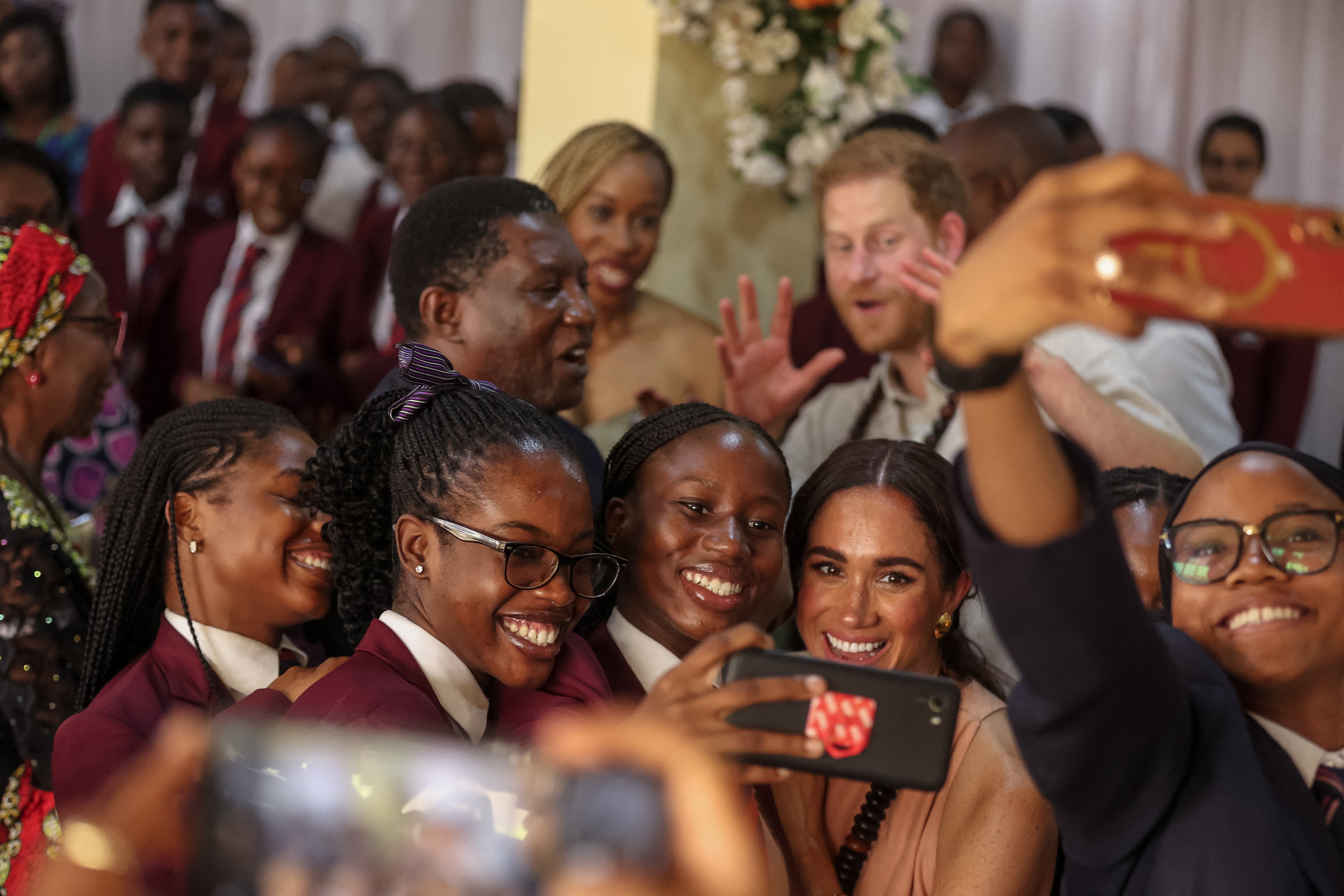 The couple also visited schools when they toured Nigeria earlier this year, even breaking traditional royal protocol to pose for a selfie with students.