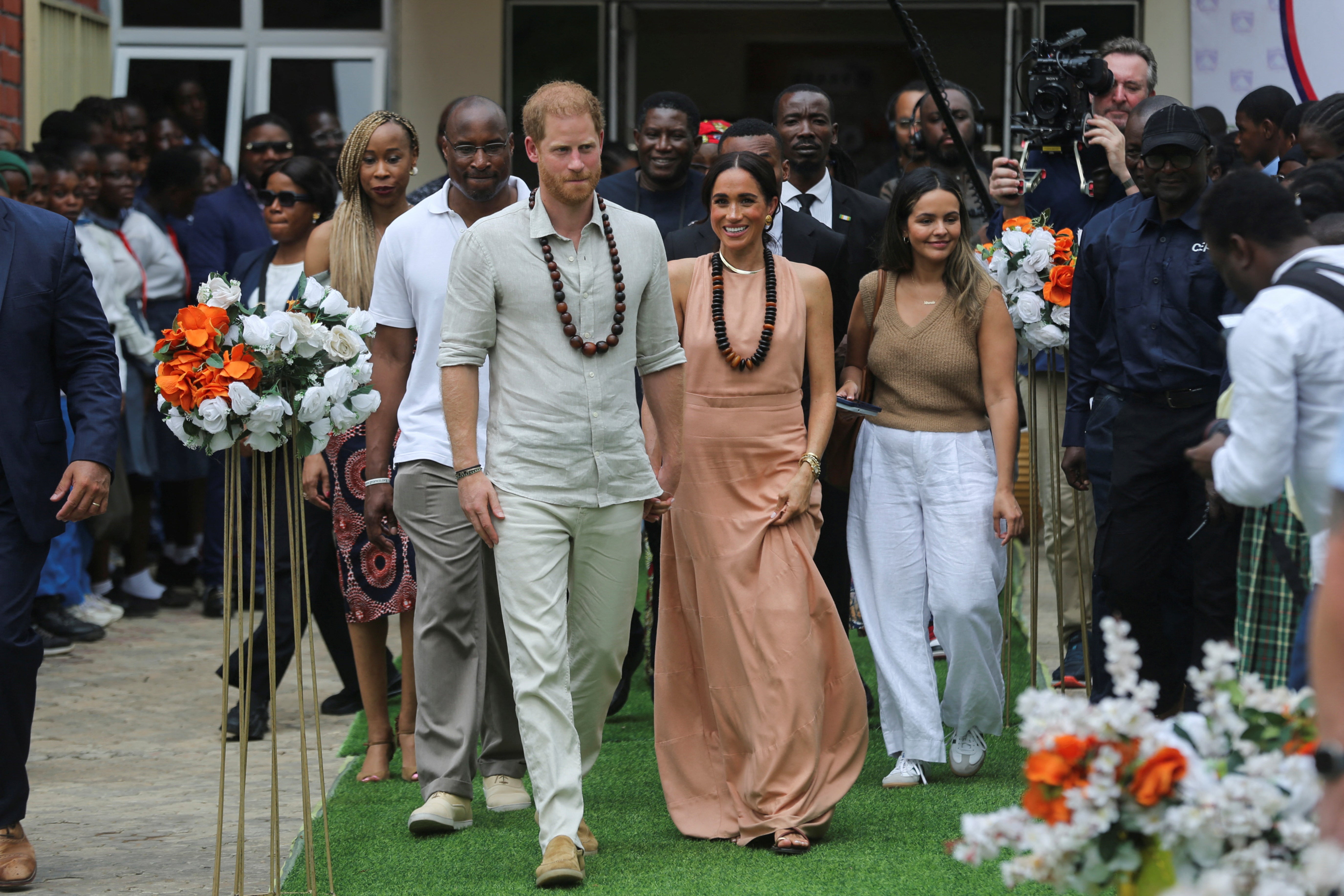 The Sussexes just after they met the students at the Lightway Academy in Abuja, Nigeria