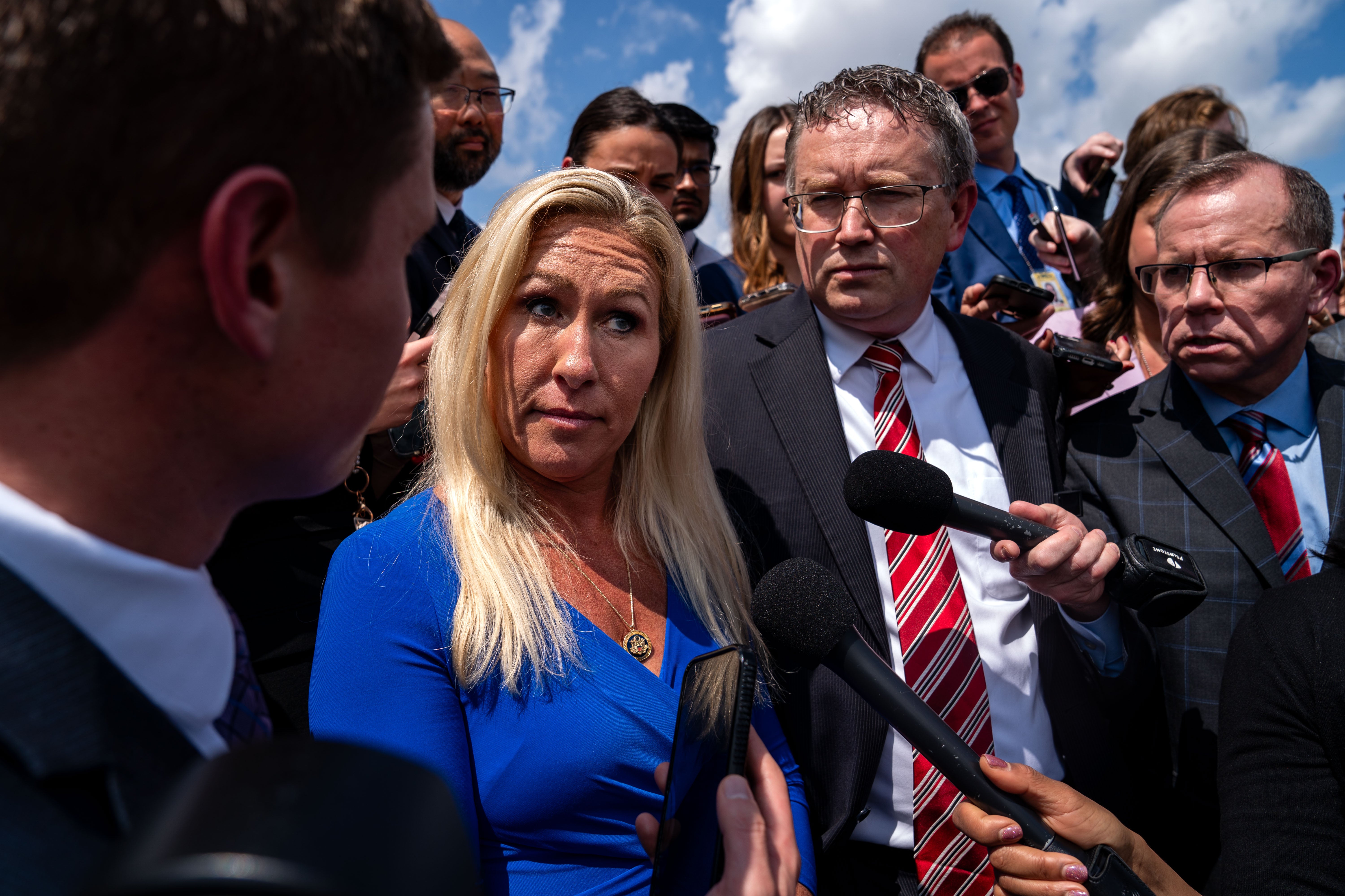 Rep. Marjorie Taylor Greene (R-GA) and Rep. Thomas Massie (R-KY) speak to members of the press on the steps of the House of Representatives after a meeting with Speaker of the House Mike Johnson (R-LA) at the U.S. Capitol on May 7, 2024 in Washington, DC