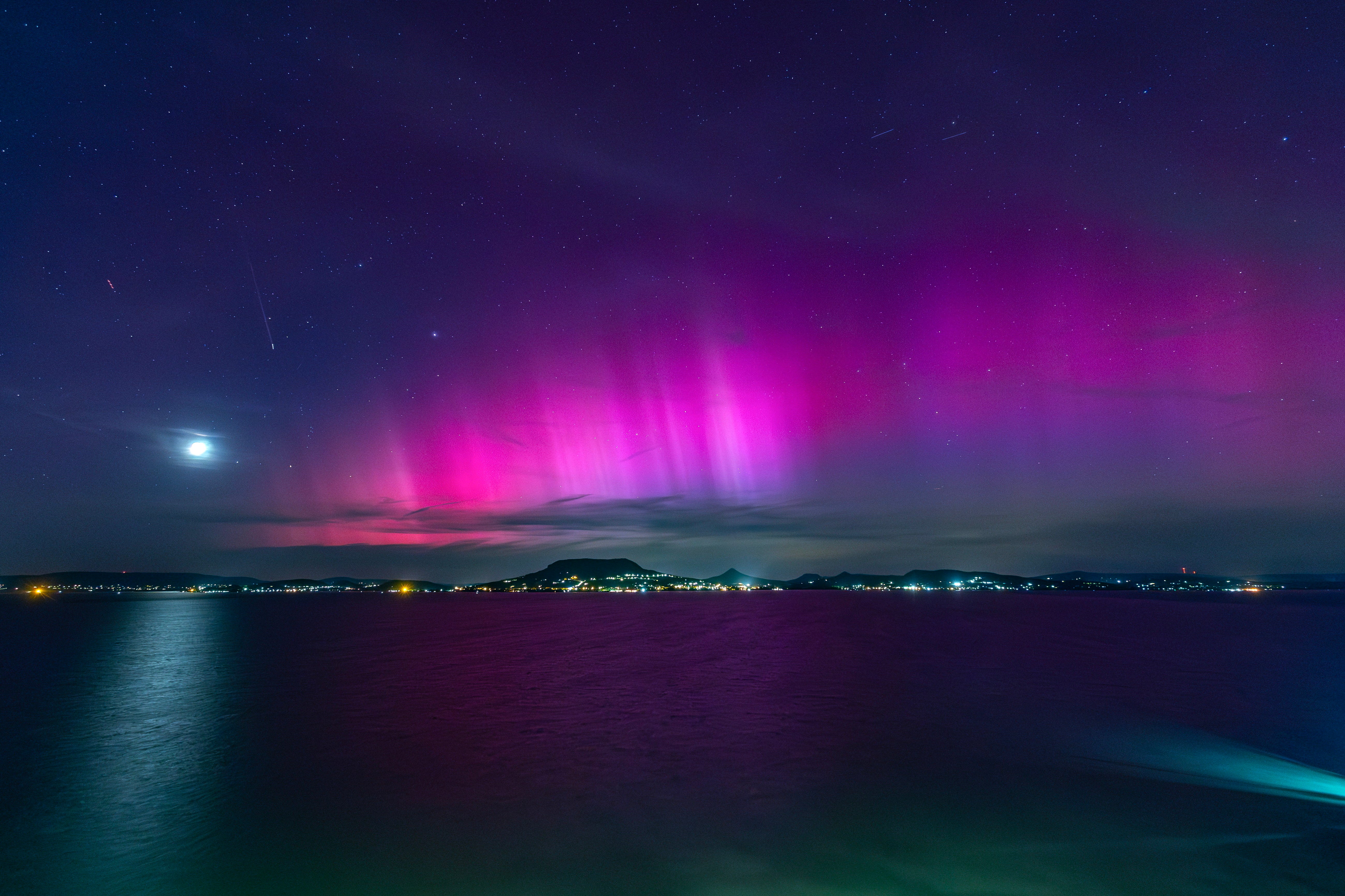 The Northern Lights illuminate the night sky over Lake Balaton near Fonyod, Hungary